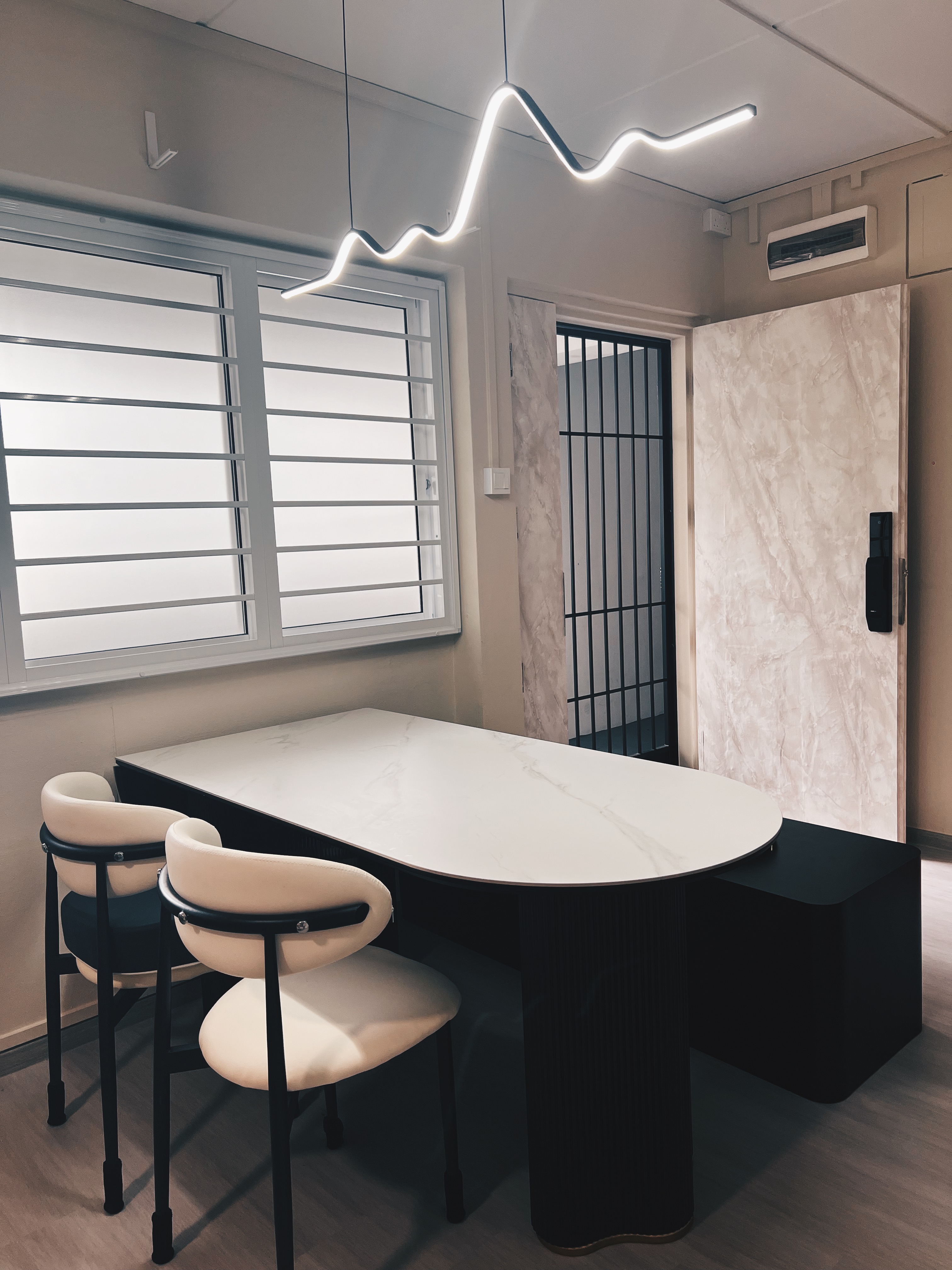 Render vs Reality: Our Dining Corner 🍽️ - Modern minimalist office space, sleek table and chairs, large window with blinds