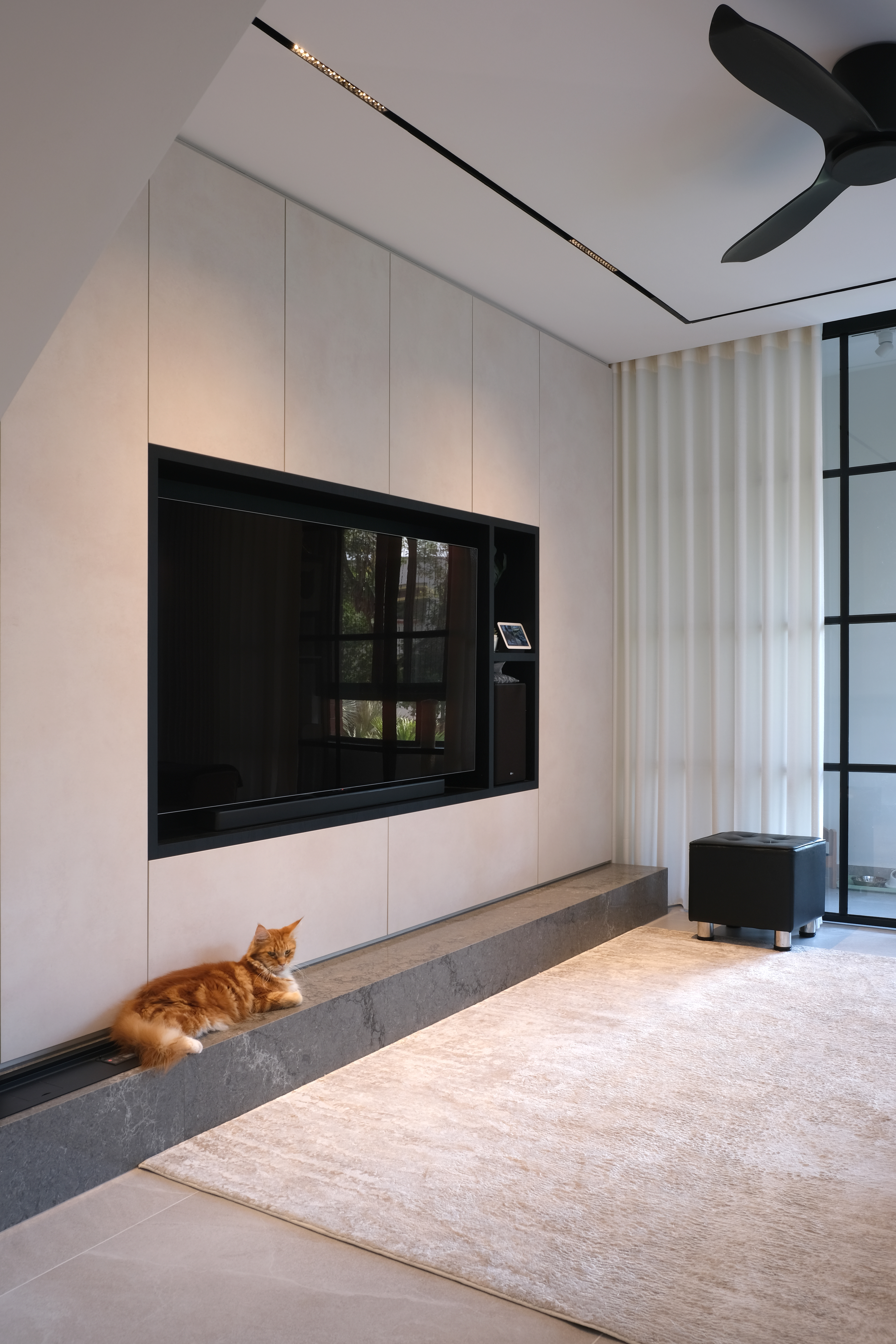 Inside a 300k Reno Modern Gallery-Inspired Maisonette - Modern minimalist living room, sleek black entertainment unit, large