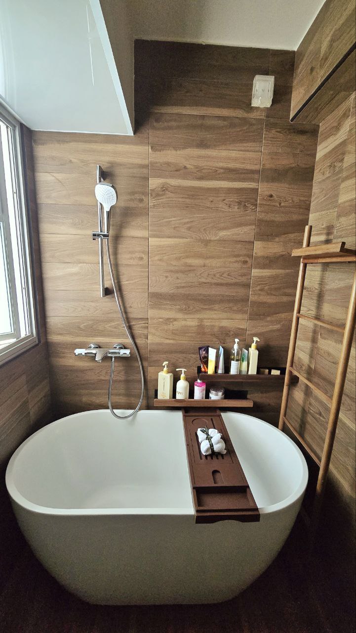 4-Room Warm, Minimalist Smart HDB Reno (50k) - Wooden bath tub, modern shower, wooden wall paneling, wooden shelf, wooden