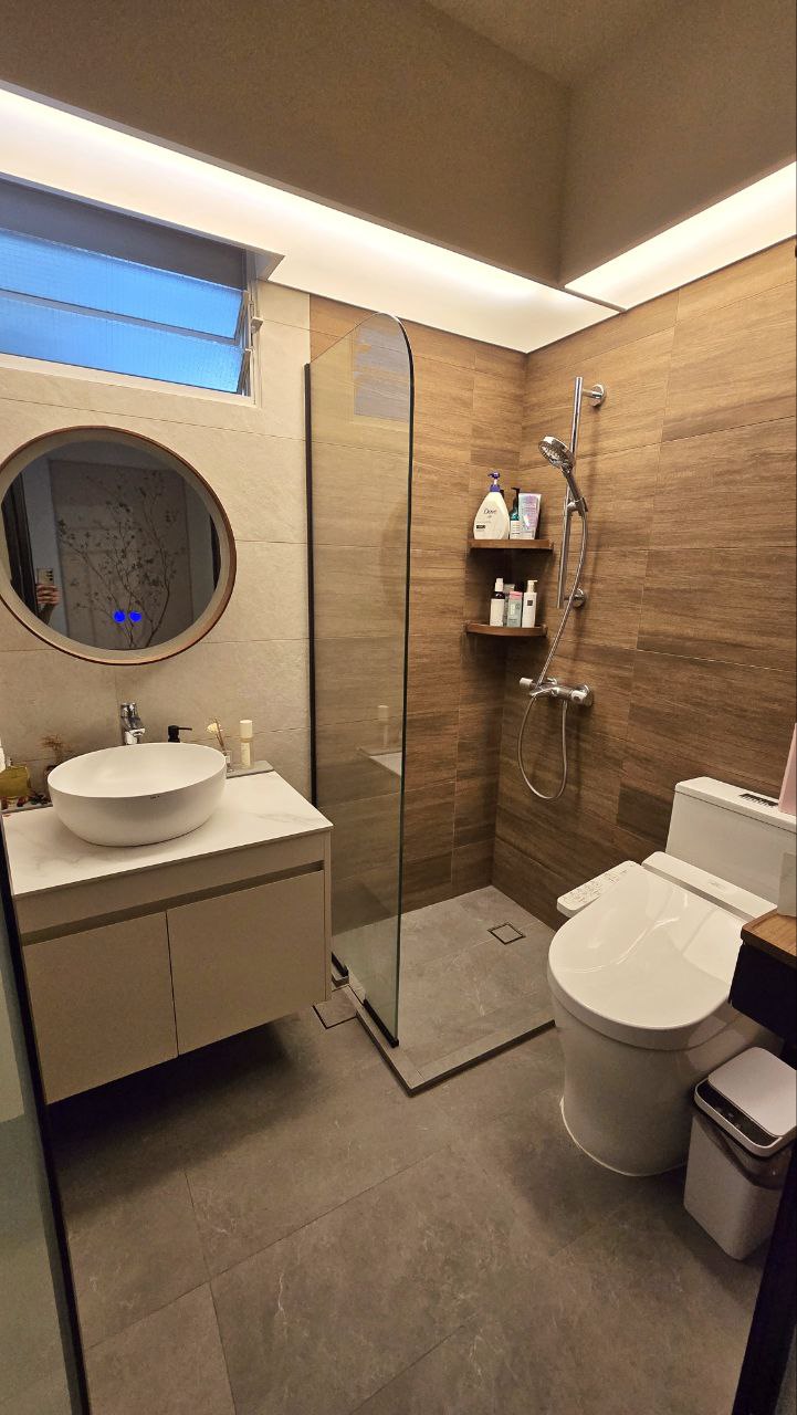 4-Room Warm, Minimalist Smart HDB Reno (50k) - Modern bathroom with sleek design, beige and brown tones, round mirror