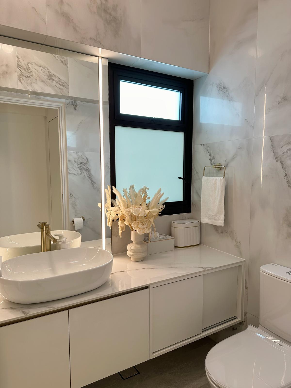 Light & airy, with a touch of luxe - White marble bathroom vanity, modern design, elegant sink, gold faucet, large mirror