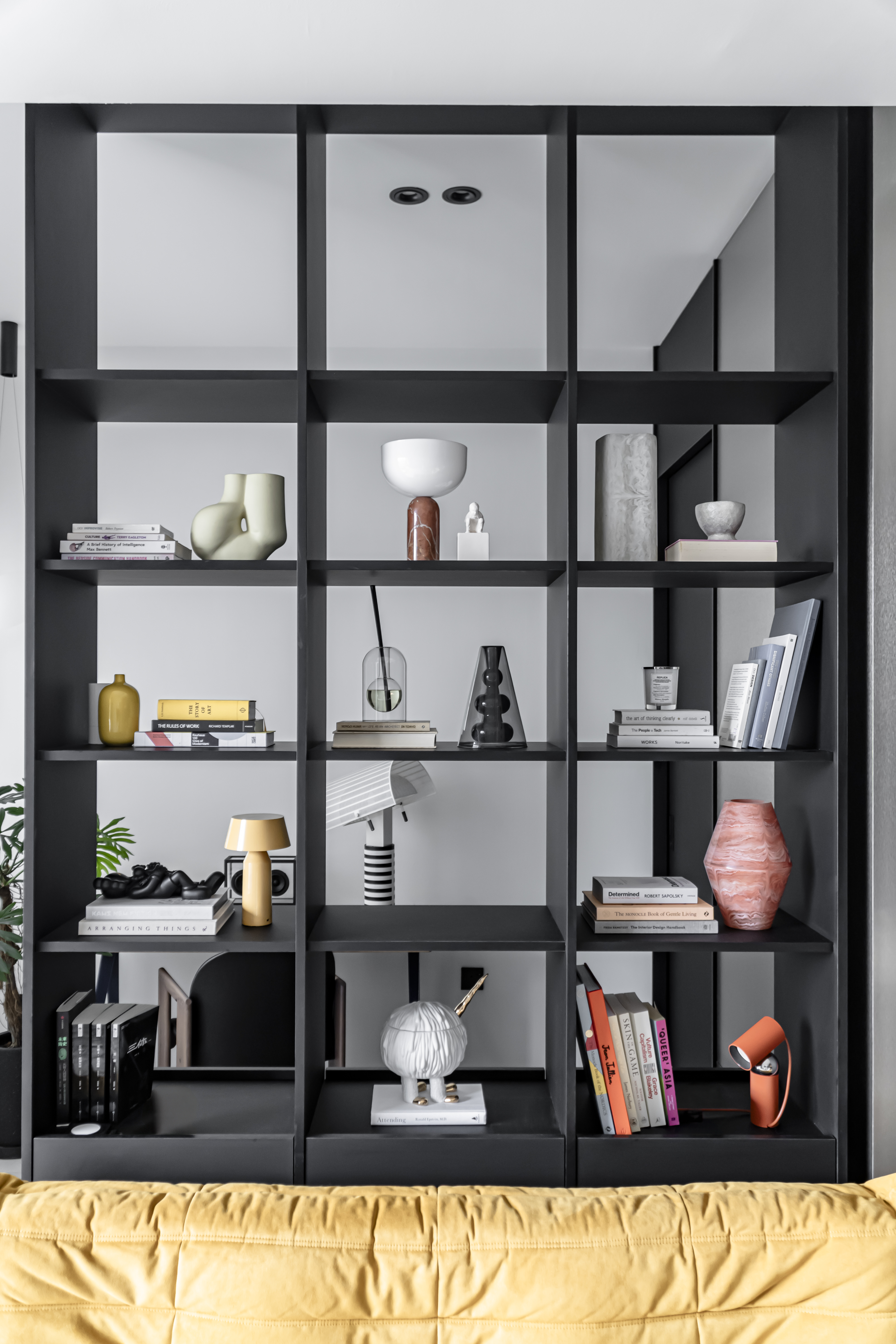 A Chic Modern Apartment Filled with Colors and Objects - modern shelving unit, minimalist design, black and white color