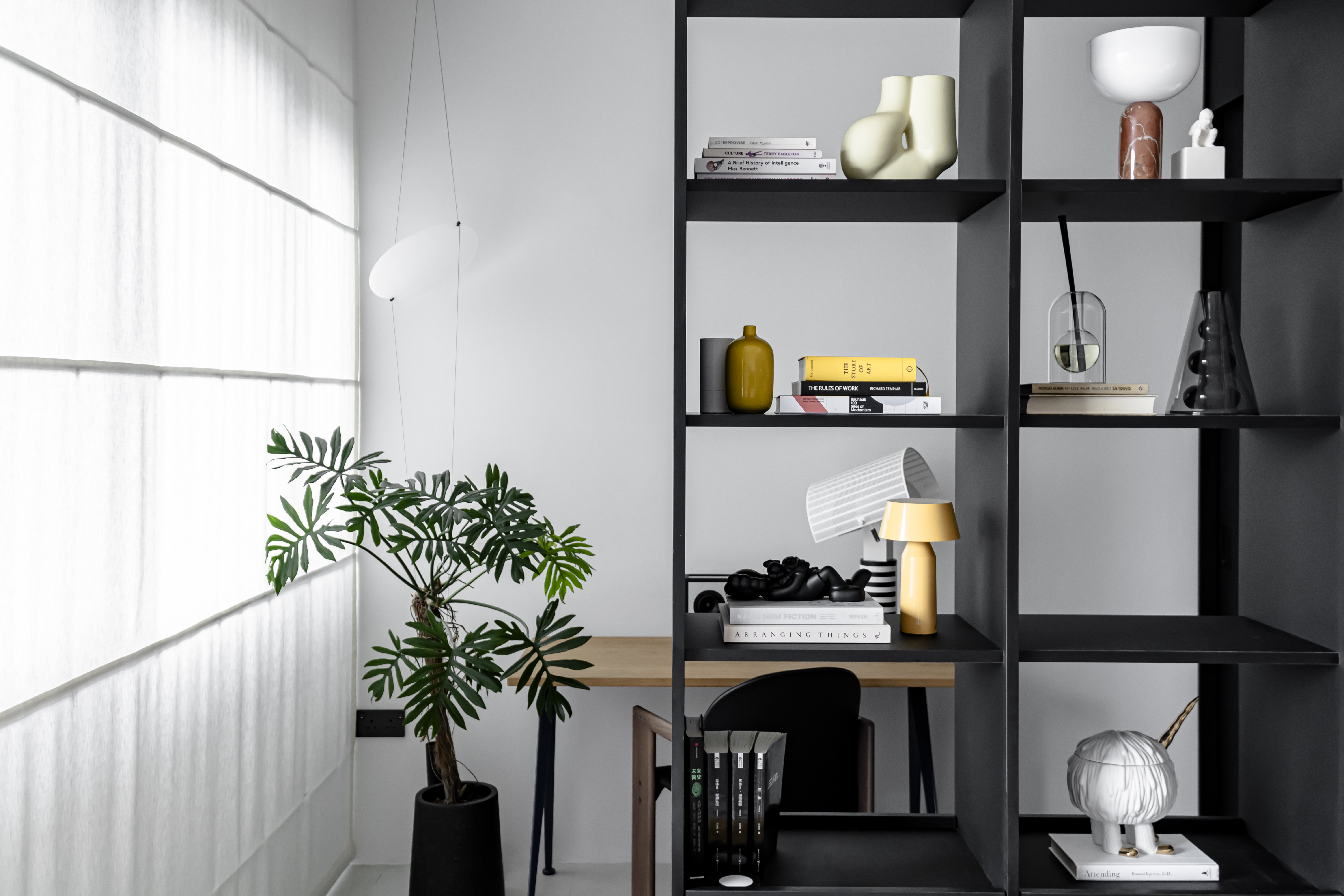 A Chic Modern Apartment Filled with Colors and Objects - Modern minimalist interior, sleek black shelving, contemporary