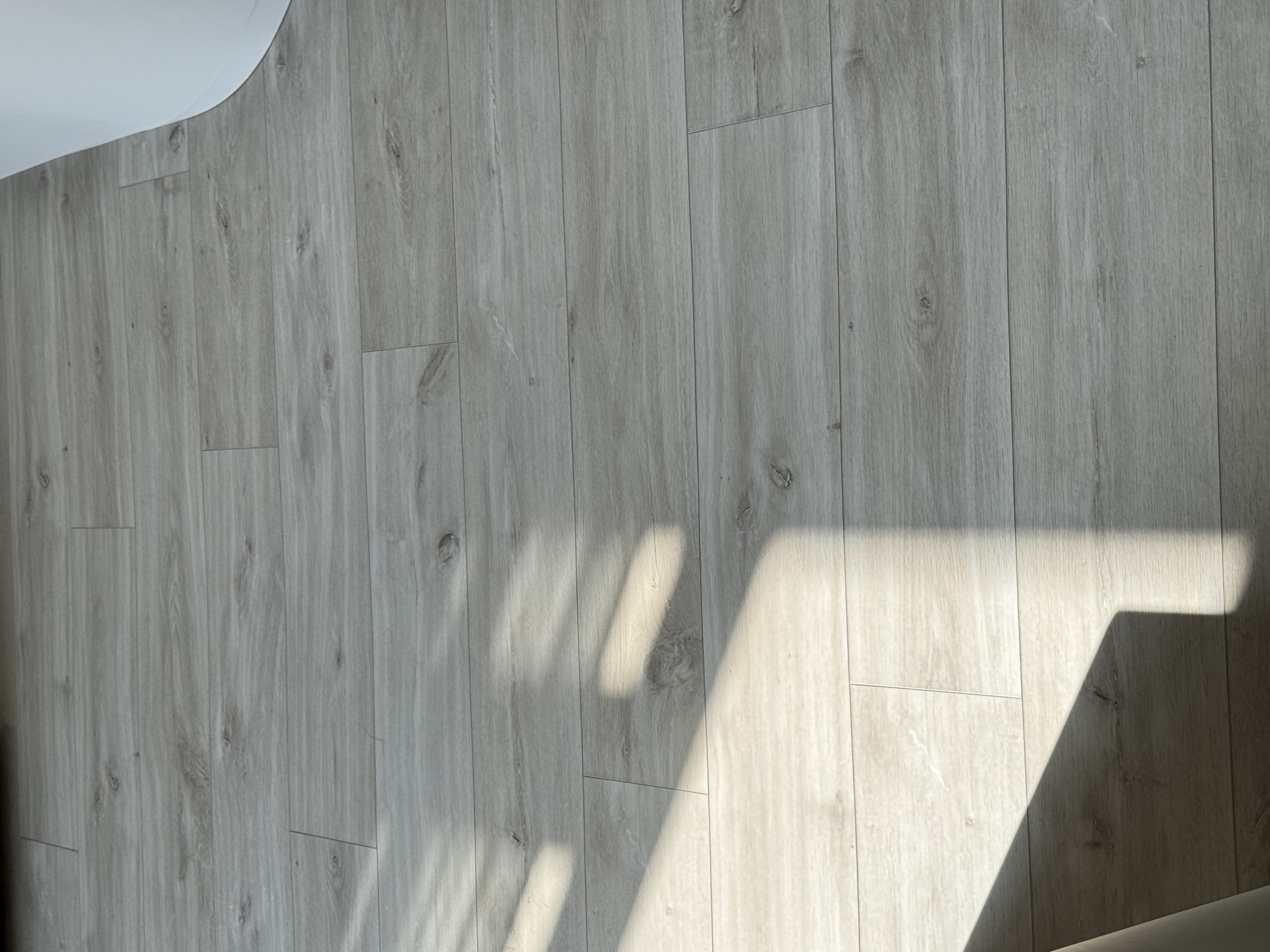 The chosen one! (How we chose our unit) - Light gray wooden wall, natural wood texture, vertical planks, sunlight casting