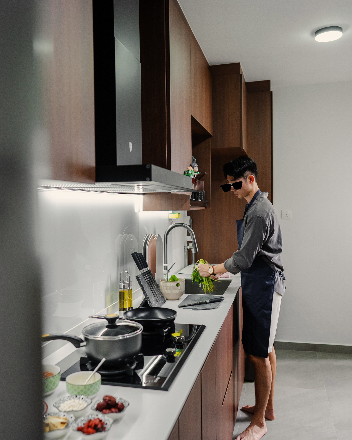 One Year Later – Our Experience & Transformation - Kitchen counter, modern kitchen, person preparing food, hands chopping