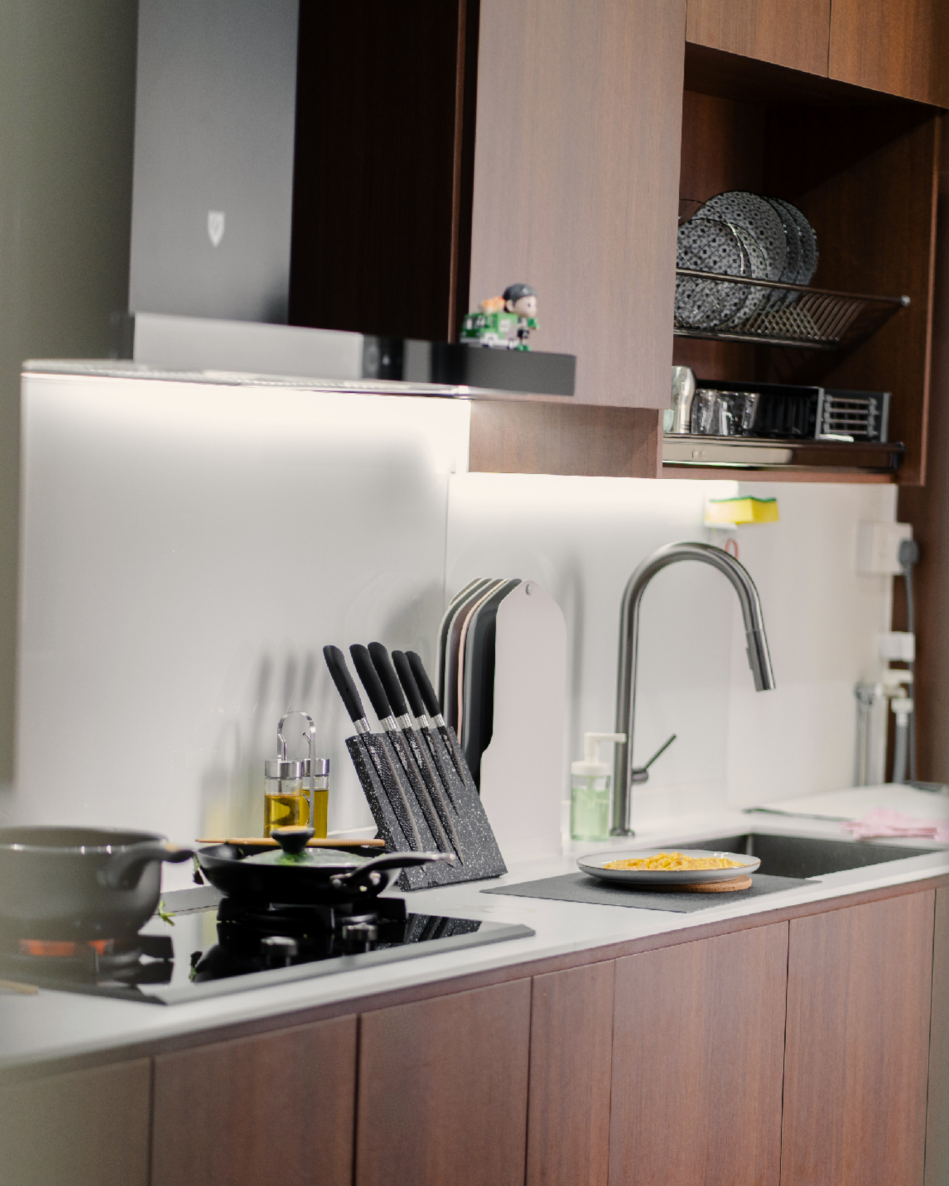 One Year Later – Our Experience & Transformation - Modern kitchen countertop, sleek design, wooden cabinets, stainless steel