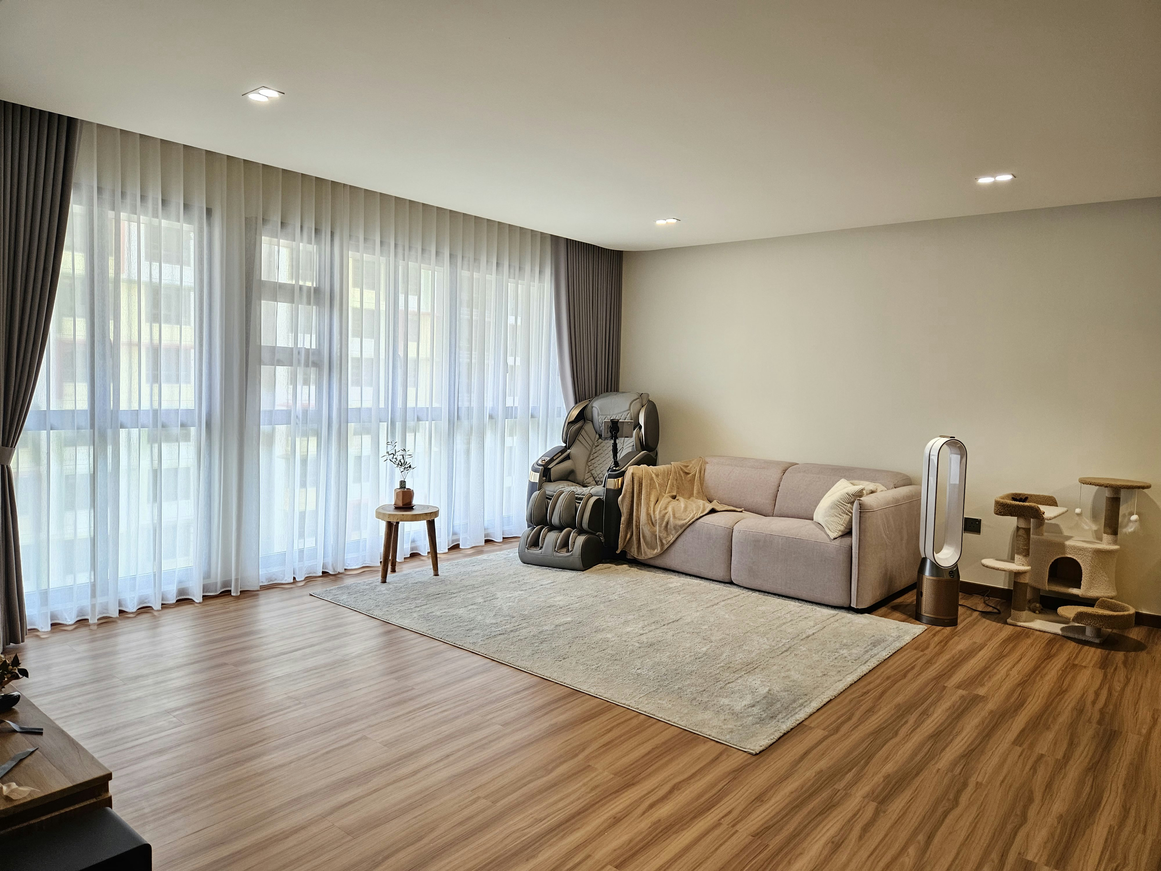 Step into our wood and pottery-filled 5-Room BTO - Large windows with sheer curtains, soft natural light, light wooden floor