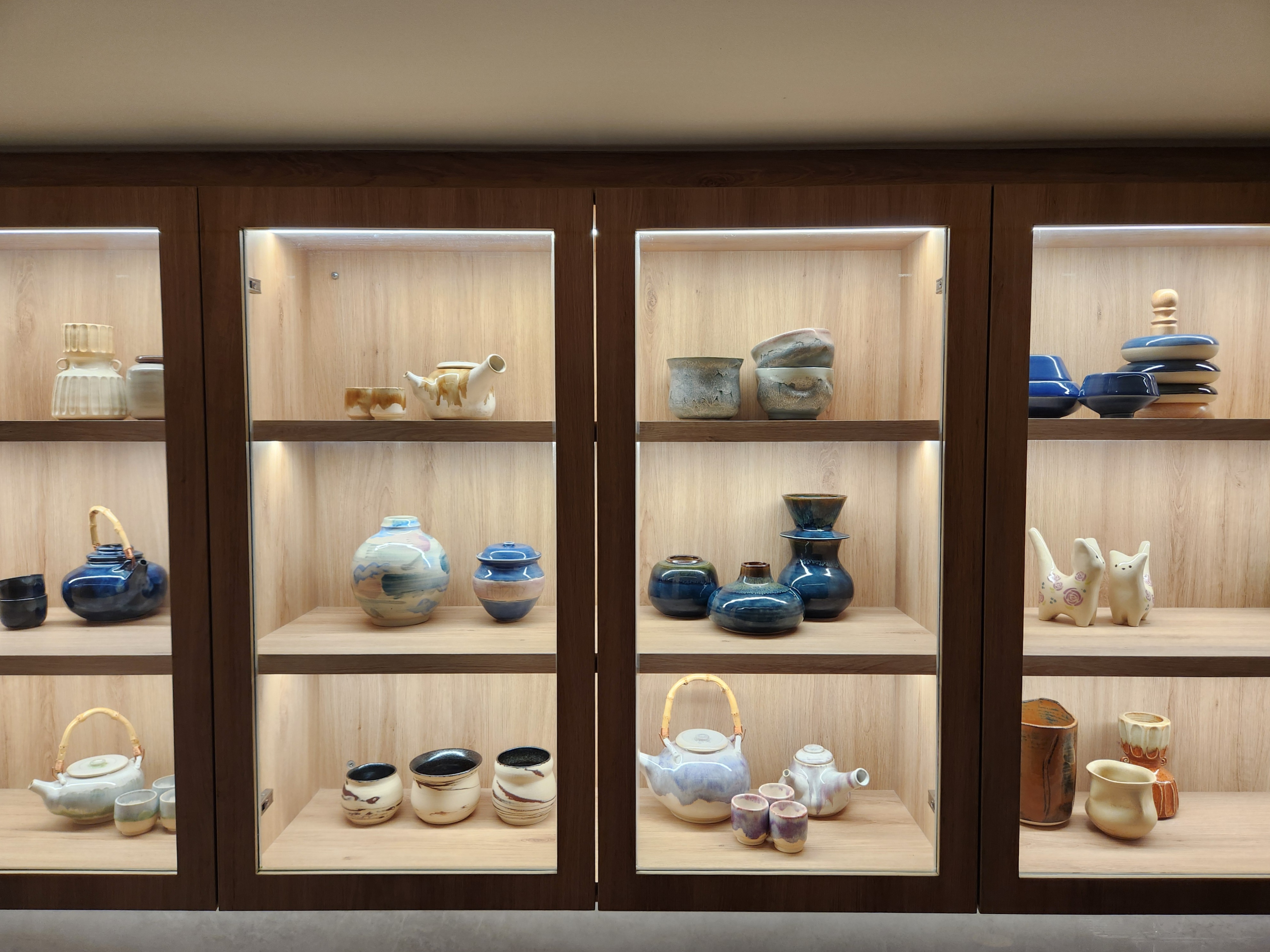 Step into our wood and pottery-filled 5-Room BTO - Tea set, ceramic teapot, blue and white teapot, wooden shelves, minimalist