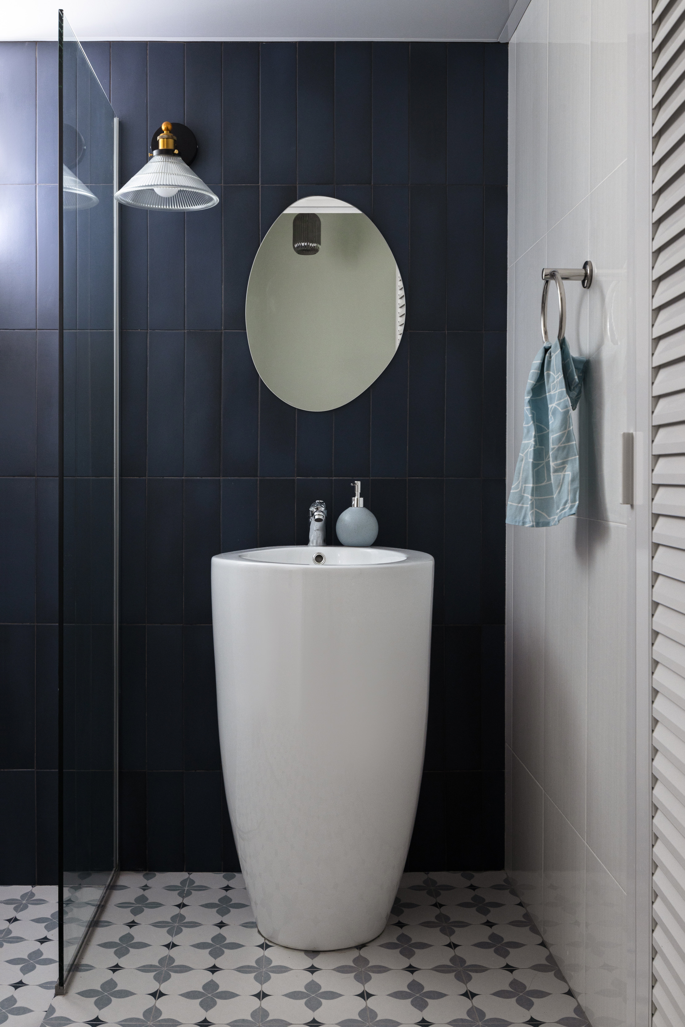 Sketches brought to life! (Renders vs Reality) - Dark blue tiled walls, modern bathroom, white pedestal sink, round mirror