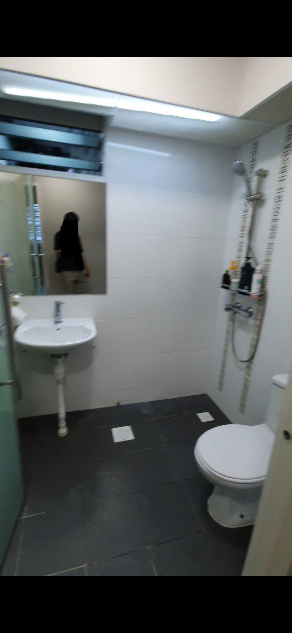 4-Room Warm, Minimalist Smart HDB Reno (50k) - Small bathroom with white tiled walls and floor, black floor tiles, white sink