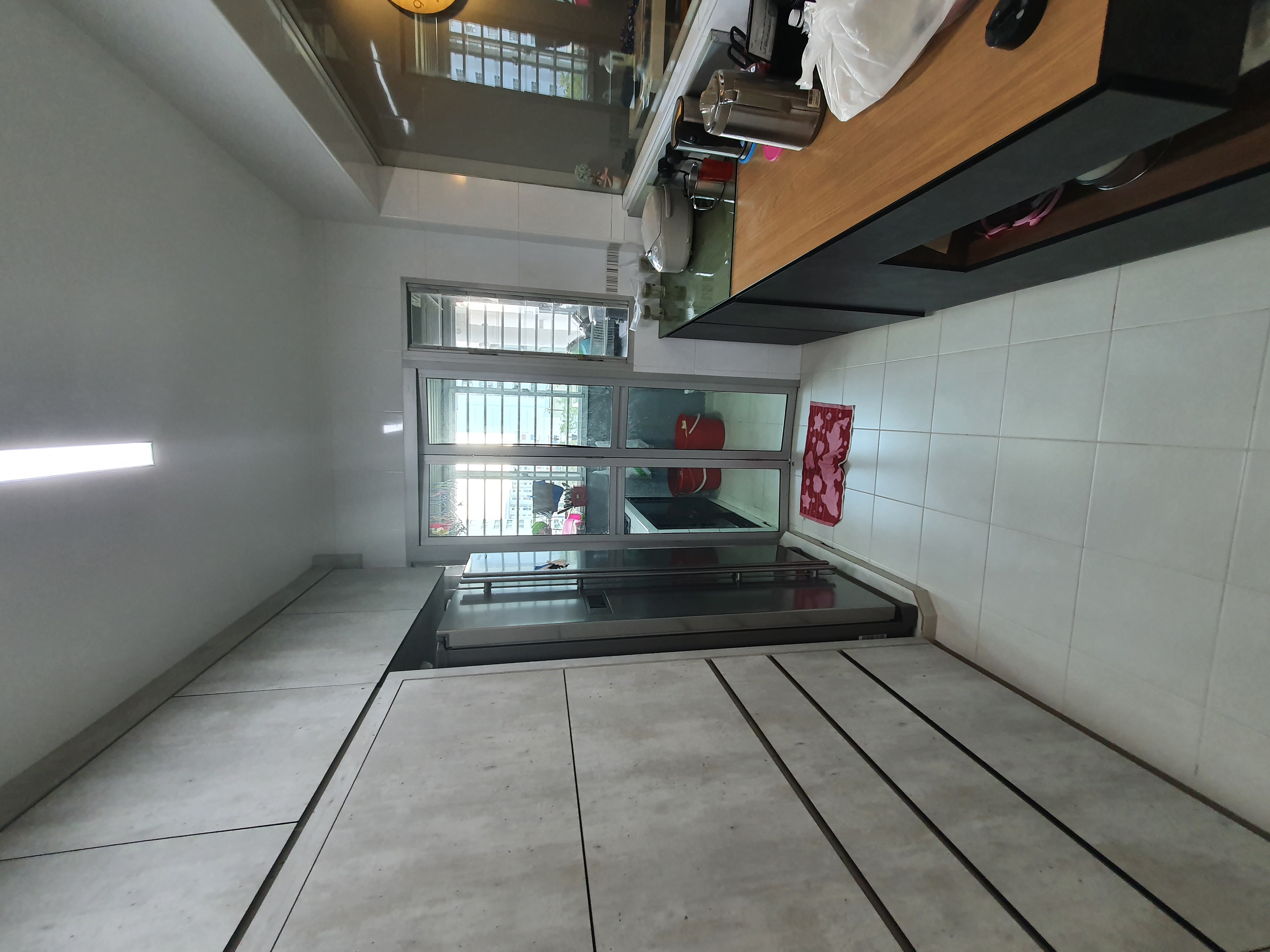4-Room Warm, Minimalist Smart HDB Reno (50k) - Modern kitchen interior, tiled floor, white walls, large windows, stainless