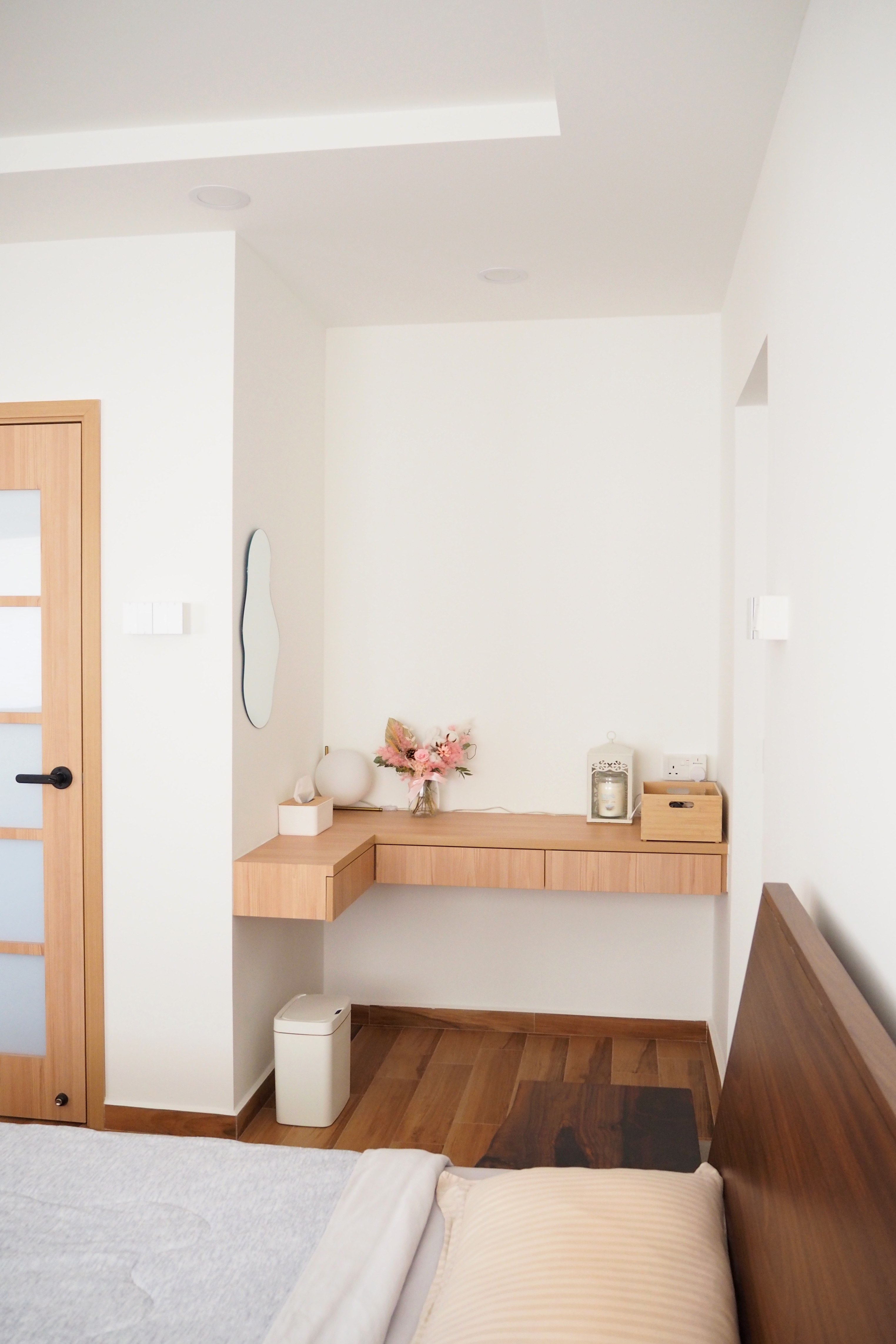 From (sketch) renders to reality - Minimalist bedroom with wooden furniture, white walls, and a wooden shelf. Soft natural