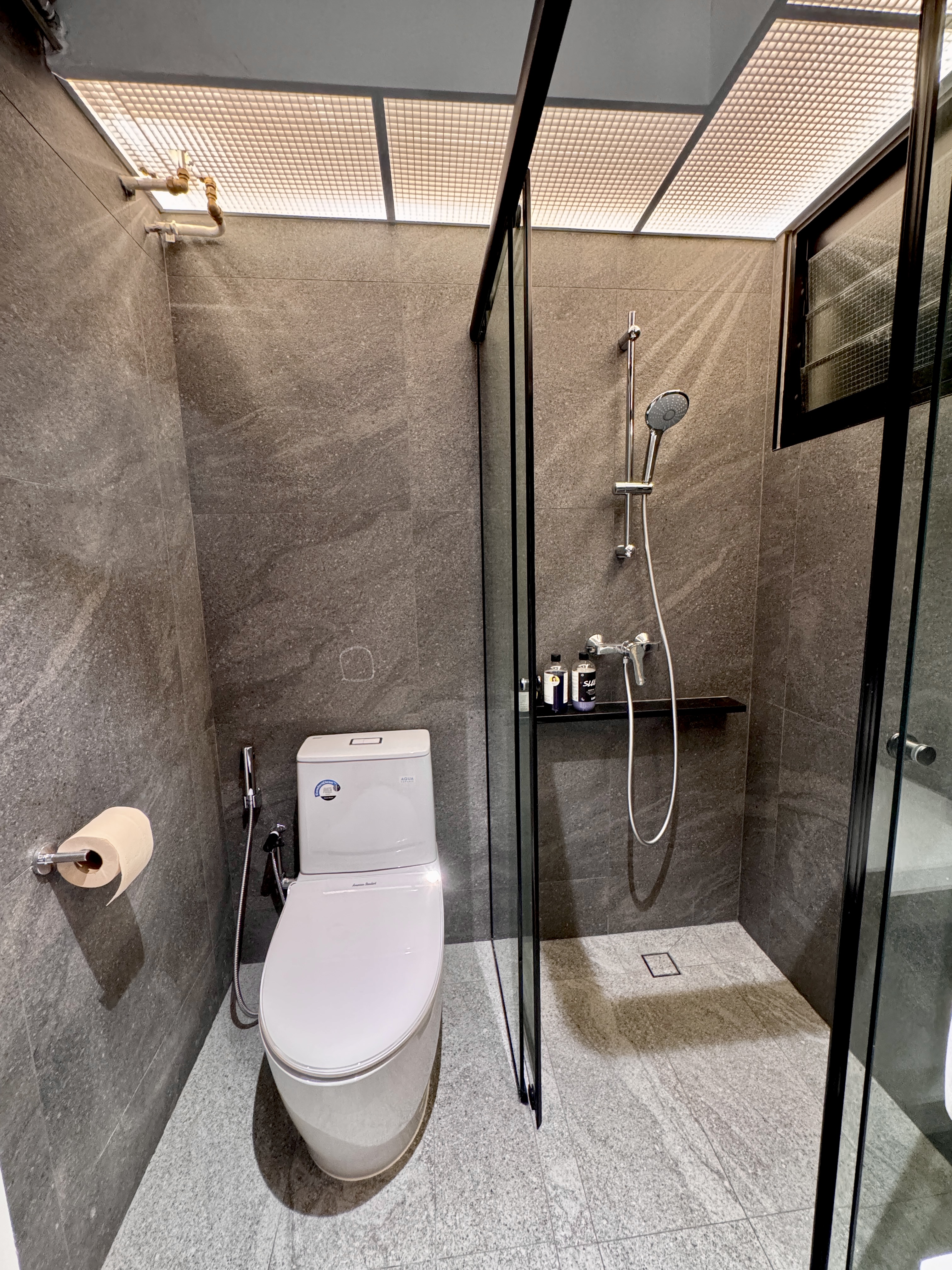 Check out this spacious dream home, a mix of Sabi Sabi & Industrial - Modern bathroom with sleek design, gray marble walls