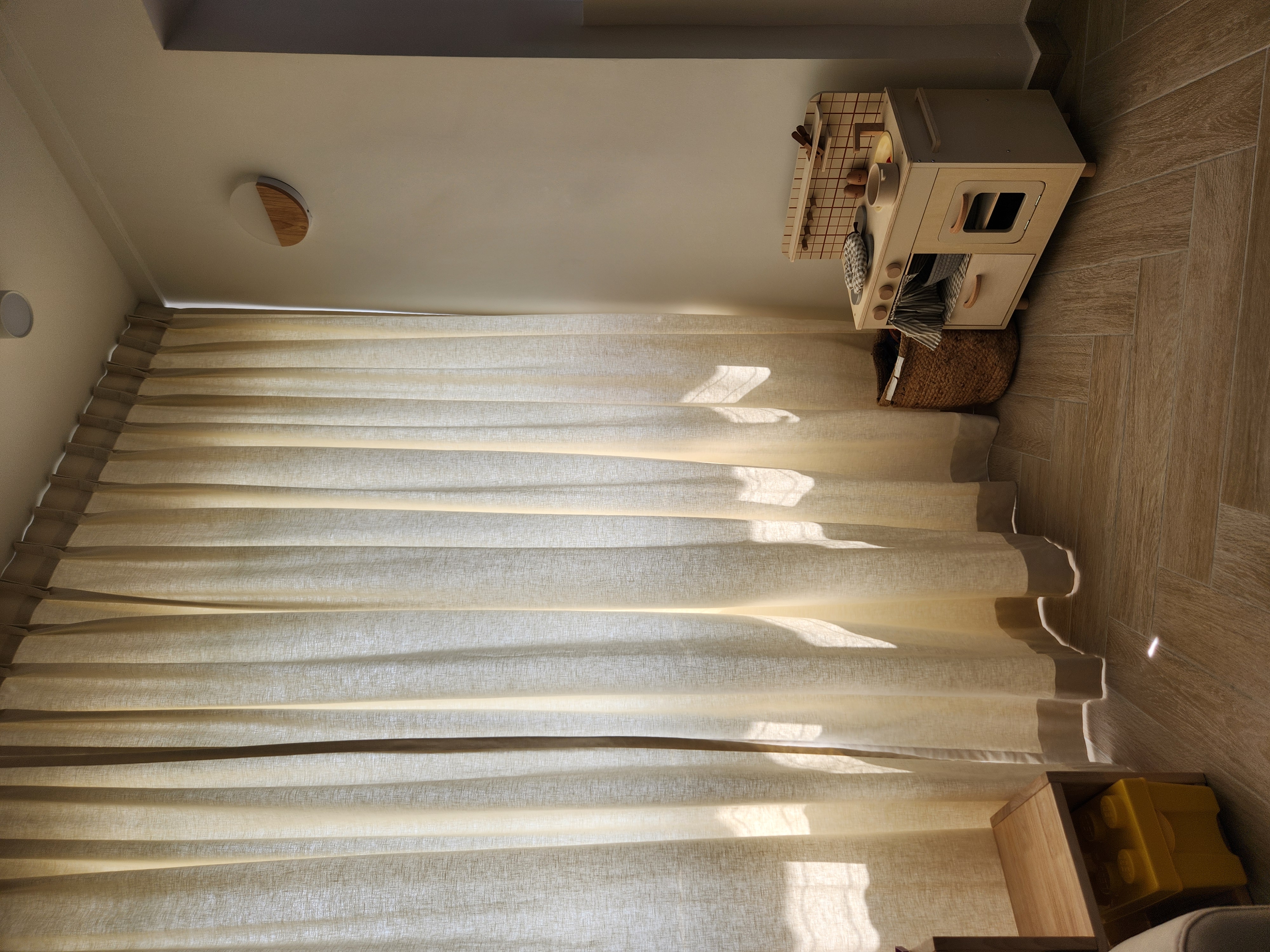 Recreating a 42Yrs Old HDB for 120K - Soft beige curtains, natural light streaming, wooden floor, cozy corner, minimalist