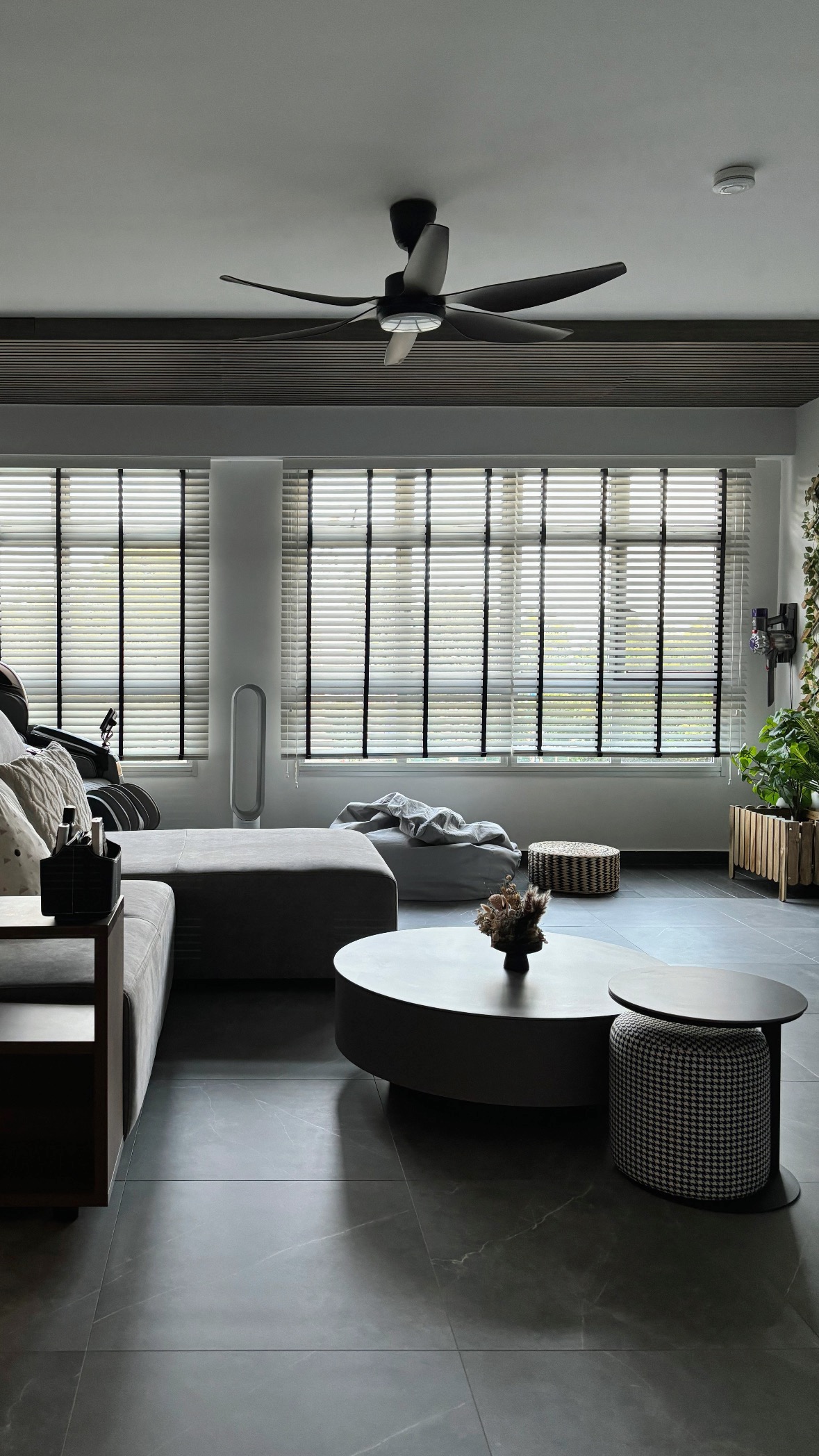 The Magic of Home by Potterhomeadventures - modern living room, minimalist design, cozy seating, gray sectional sofa, black