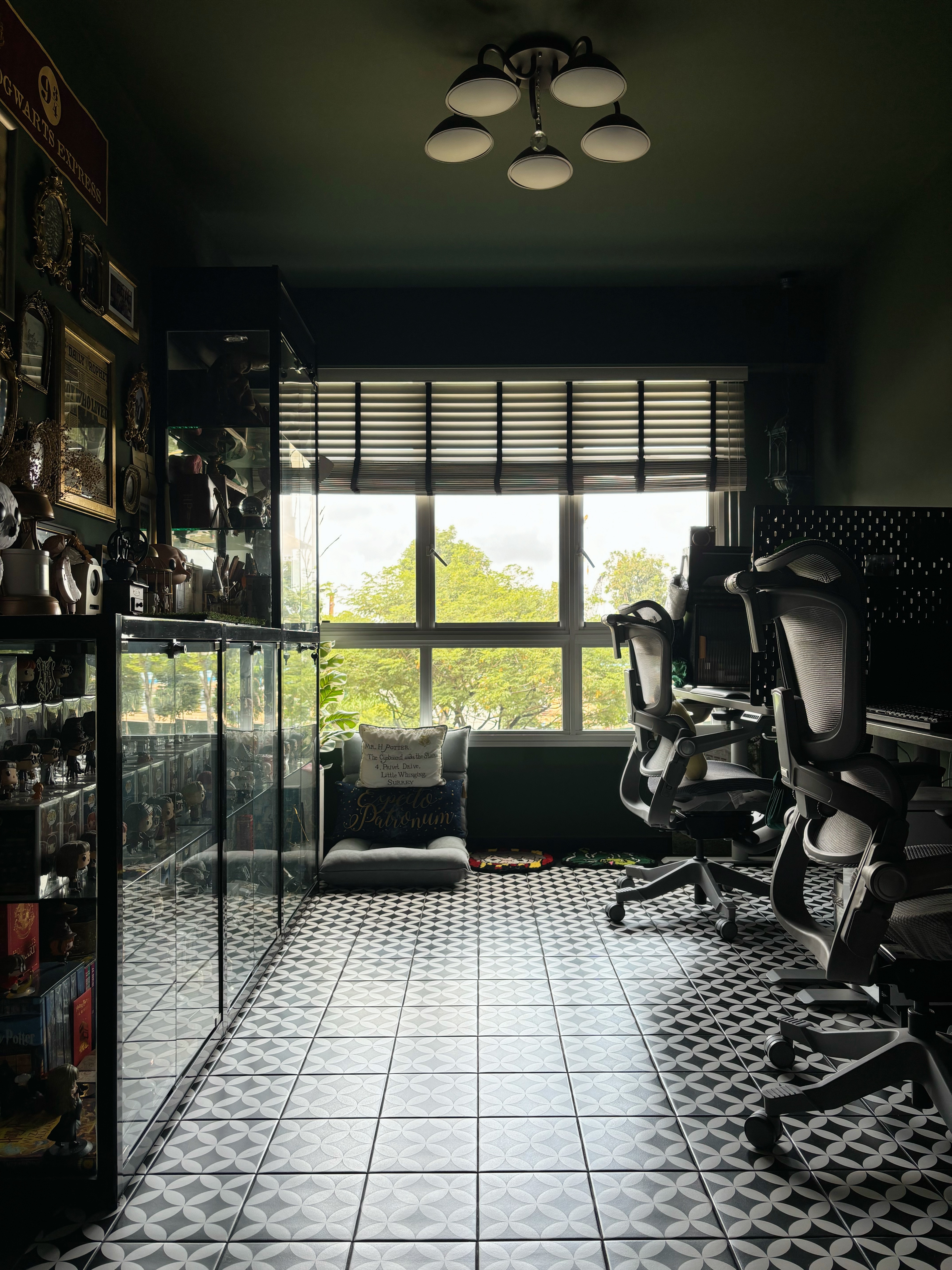 The Magic of Home by Potterhomeadventures - Dark room with vintage decor, framed pictures, and a sign reading "Hogwarts