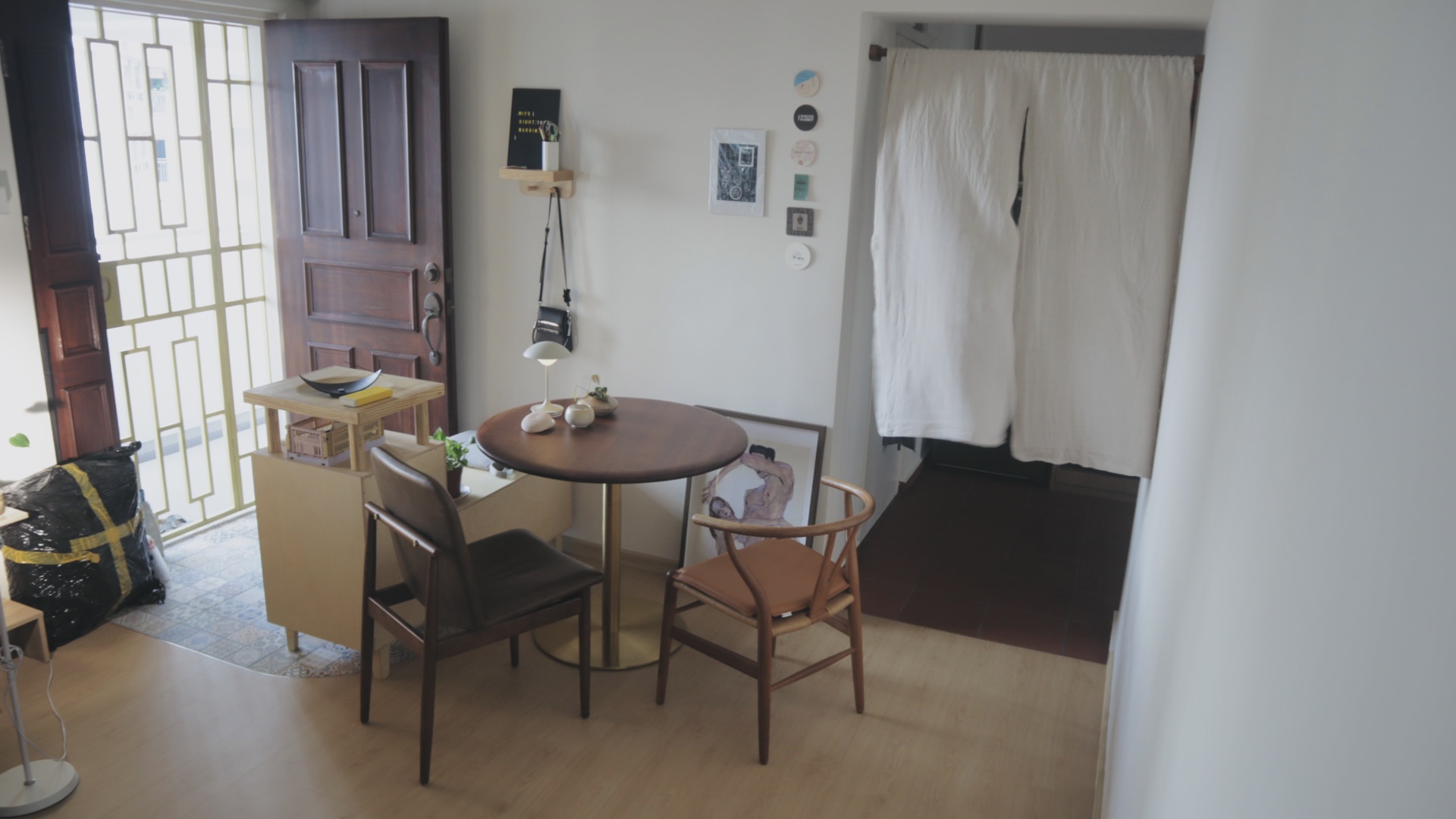 mobile dining space for two; nomad dining room!  - Wooden dining table, black chair, wooden chair, round wooden table, wooden