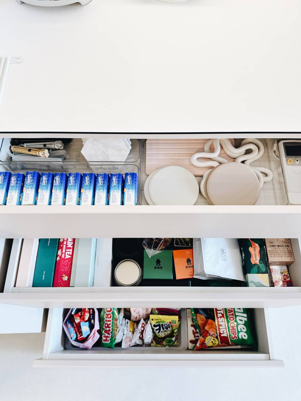 Our Dining Room: 3m of uncluttered storage space!  - Organized pantry drawer, neatly arranged items, white shelves, blue