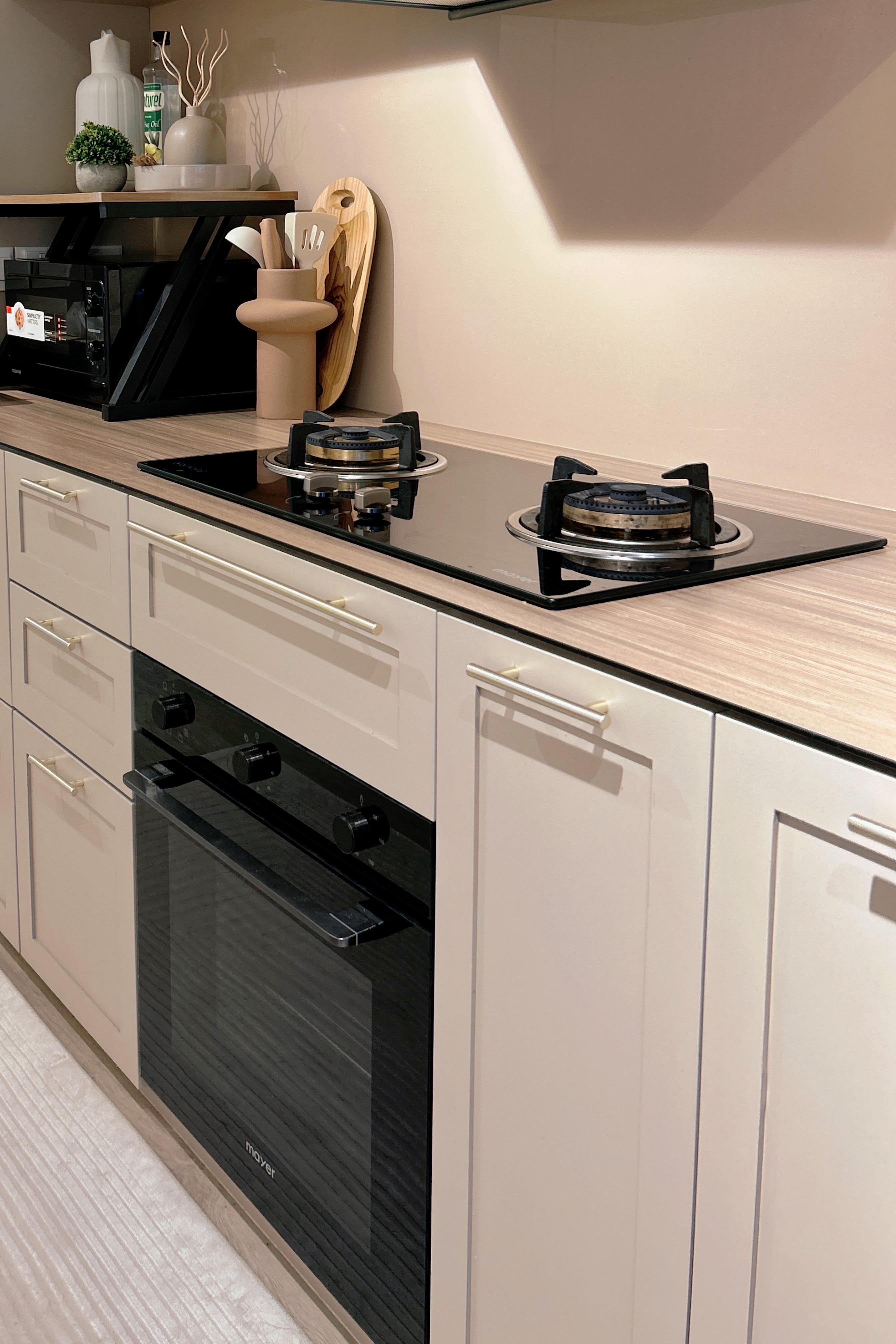 An Open-Concept Galley Kitchen: Where Style Meets Function - Modern kitchen countertop, sleek appliances, black stove, gas