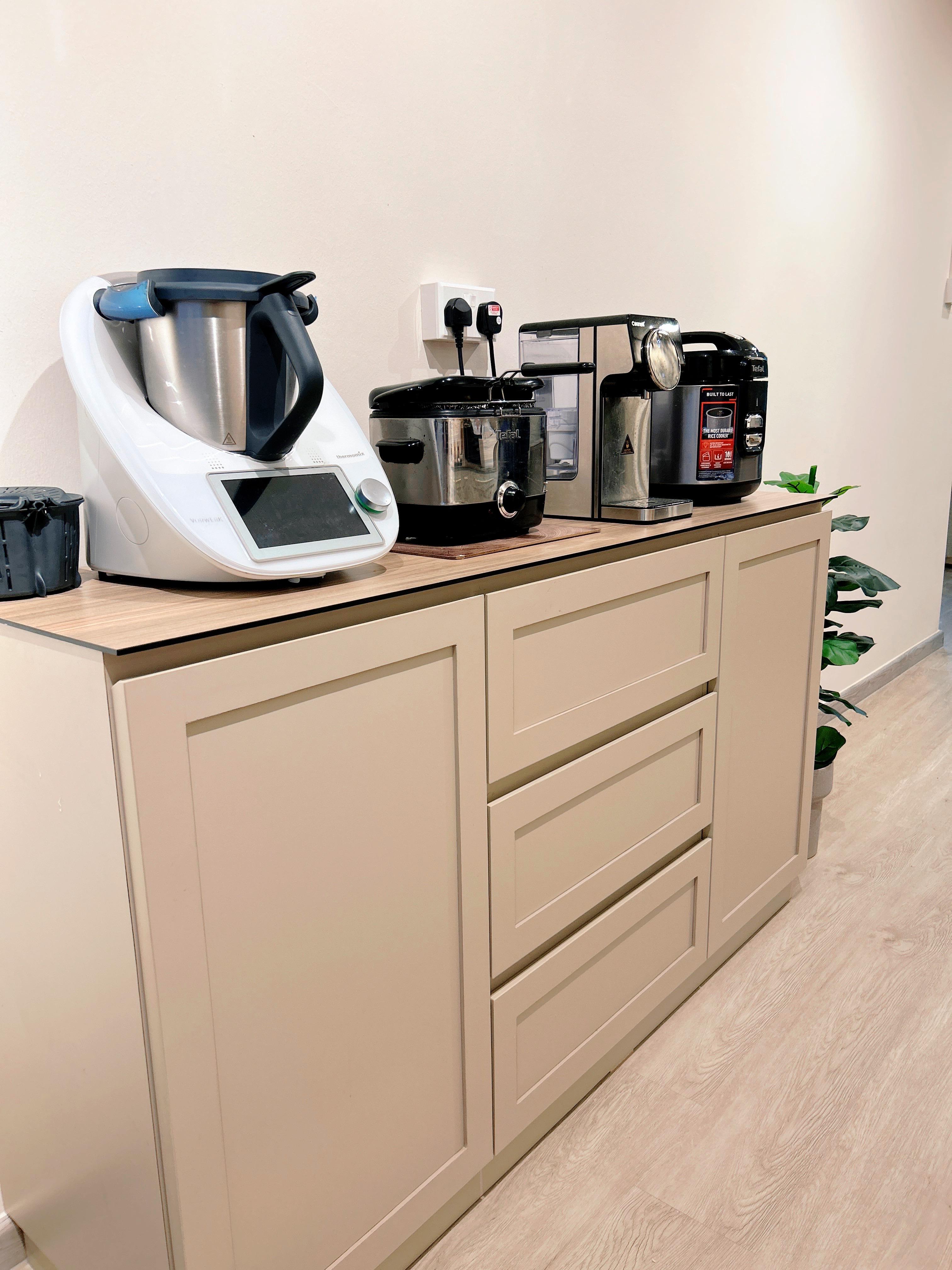 An Open-Concept Galley Kitchen: Where Style Meets Function - White kitchen appliance, black rice cooker, stainless steel pot