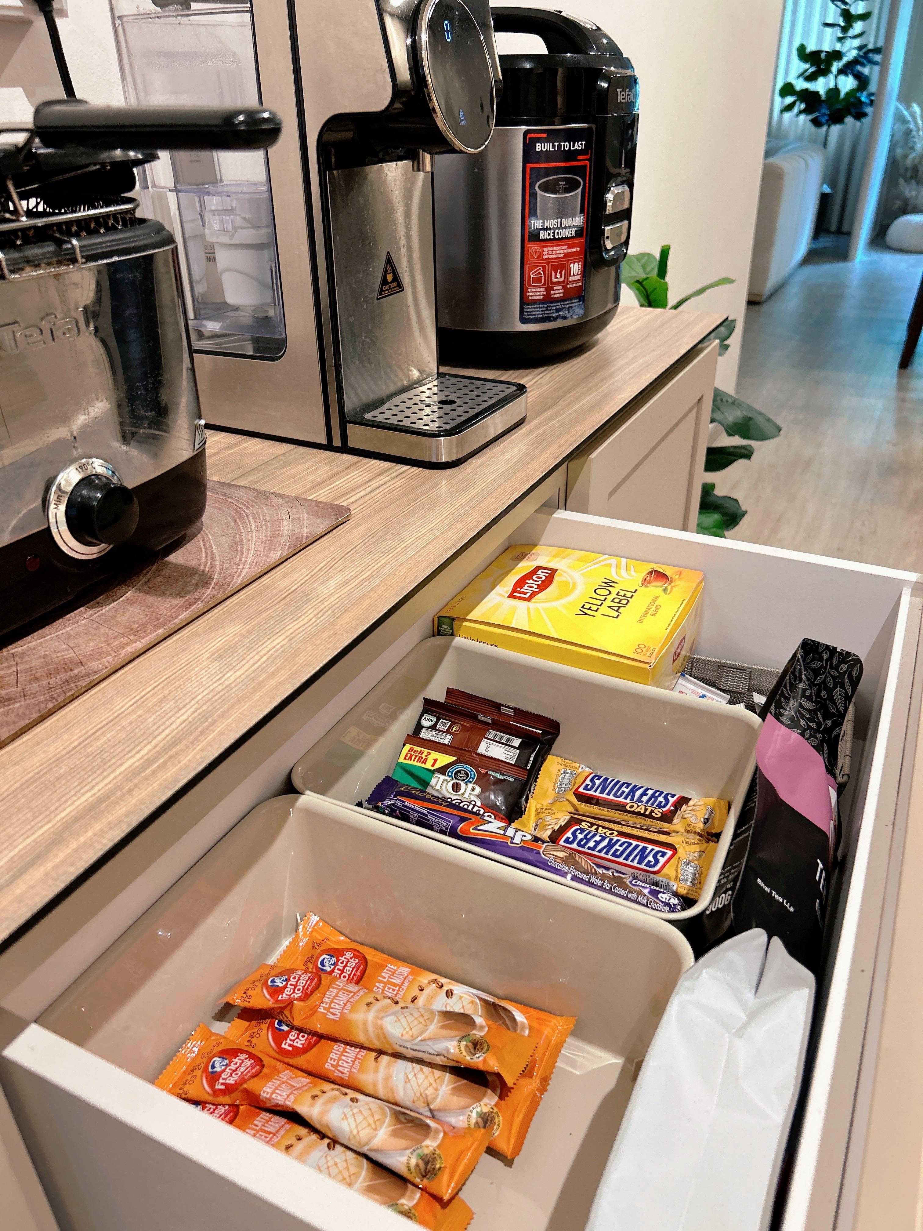 An Open-Concept Galley Kitchen: Where Style Meets Function - Miniature rice cooker, kitchen appliances, countertop, stainless