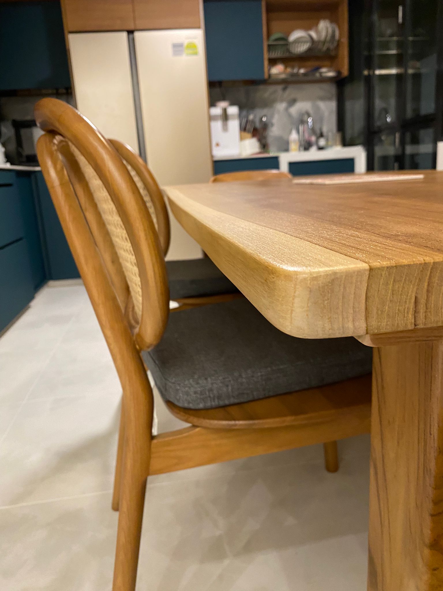 Dining in wood and tropical serenity - Wooden dining table with curved chairs, kitchen cabinets, modern design, wooden chair