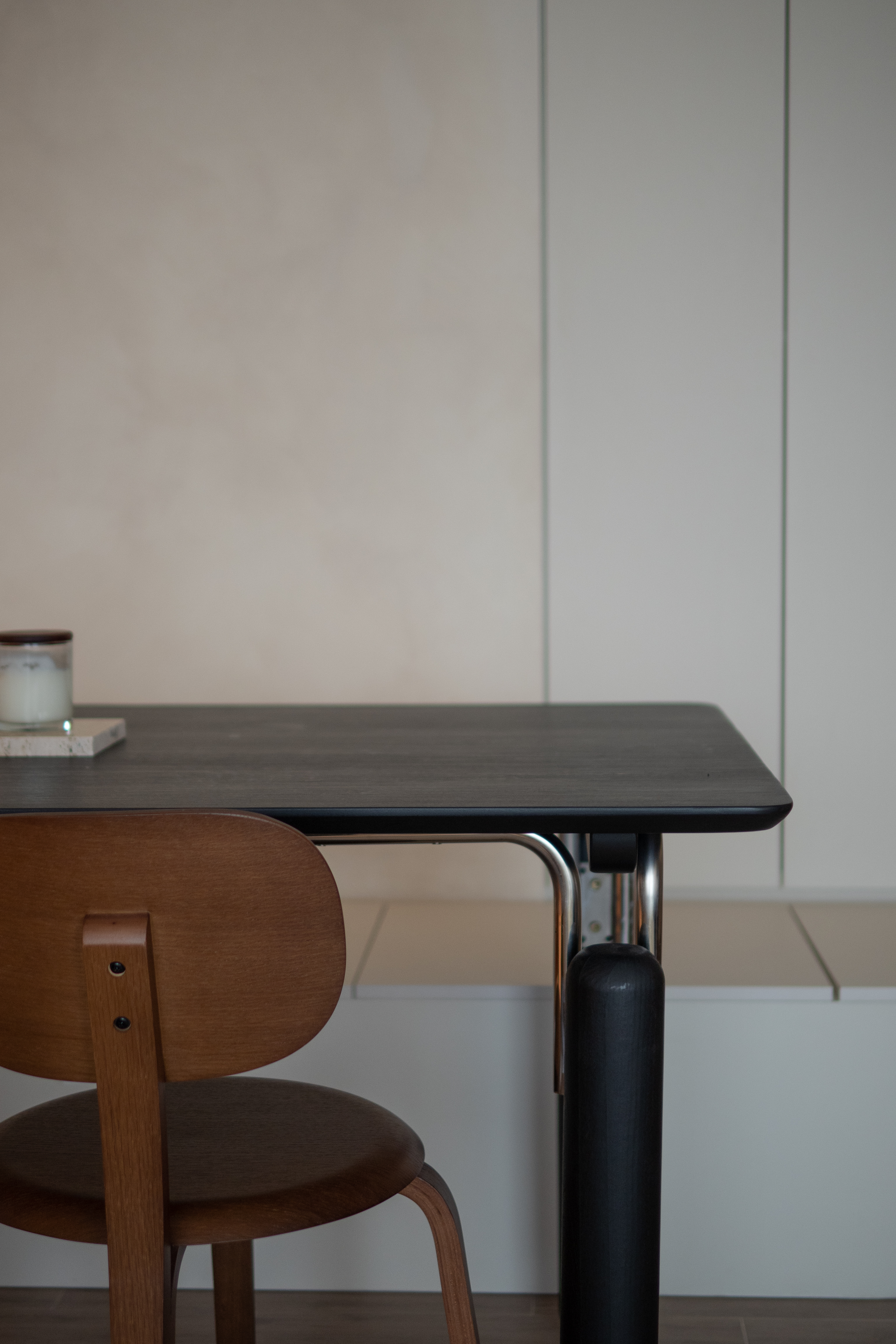 Embracing Minimalism in our Airy Dining Nook  - modern minimalist dining room, wooden chair, brown leather chair, sleek