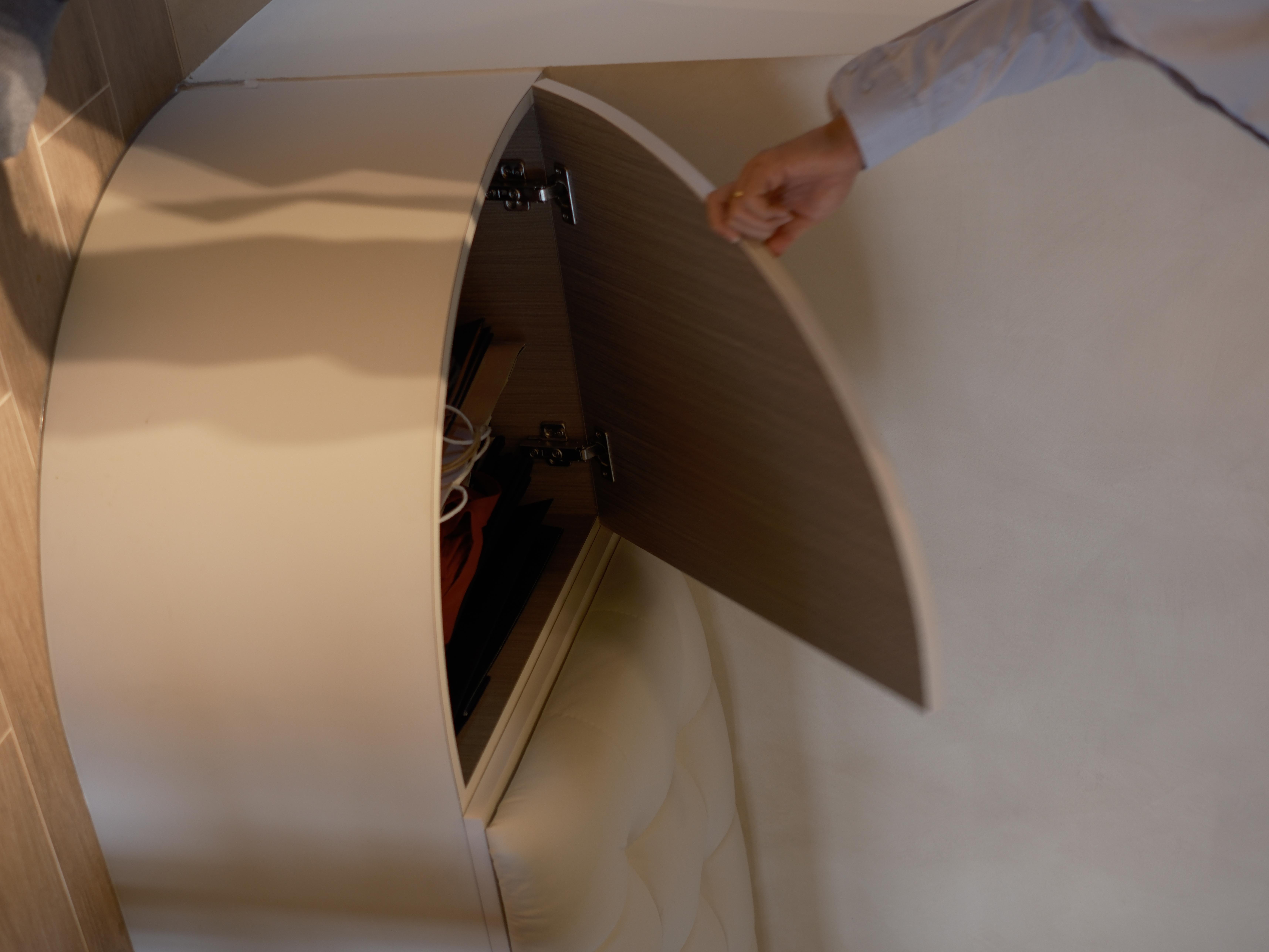 Embracing Minimalism in our Airy Dining Nook  - Curved, open, wooden, cabinet, beige, interior, soft lighting, person's hand