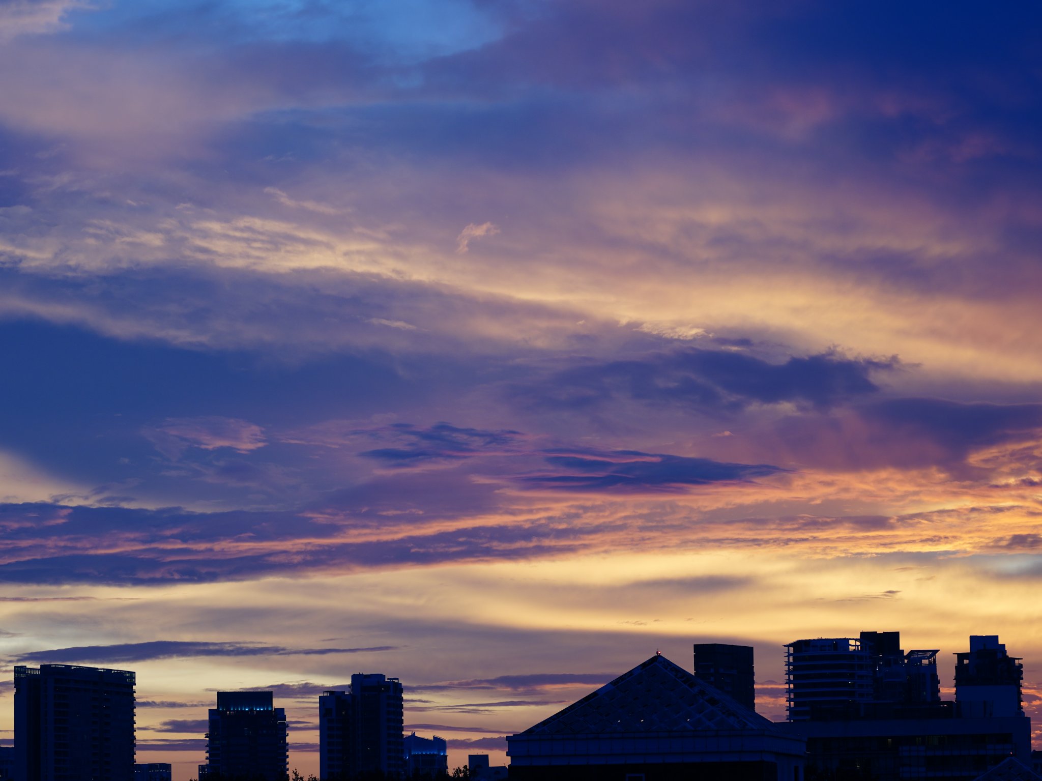 The Heart: The many faces of our Dining Room - Dramatic sky with vibrant hues of purple, pink, and orange, transitioning