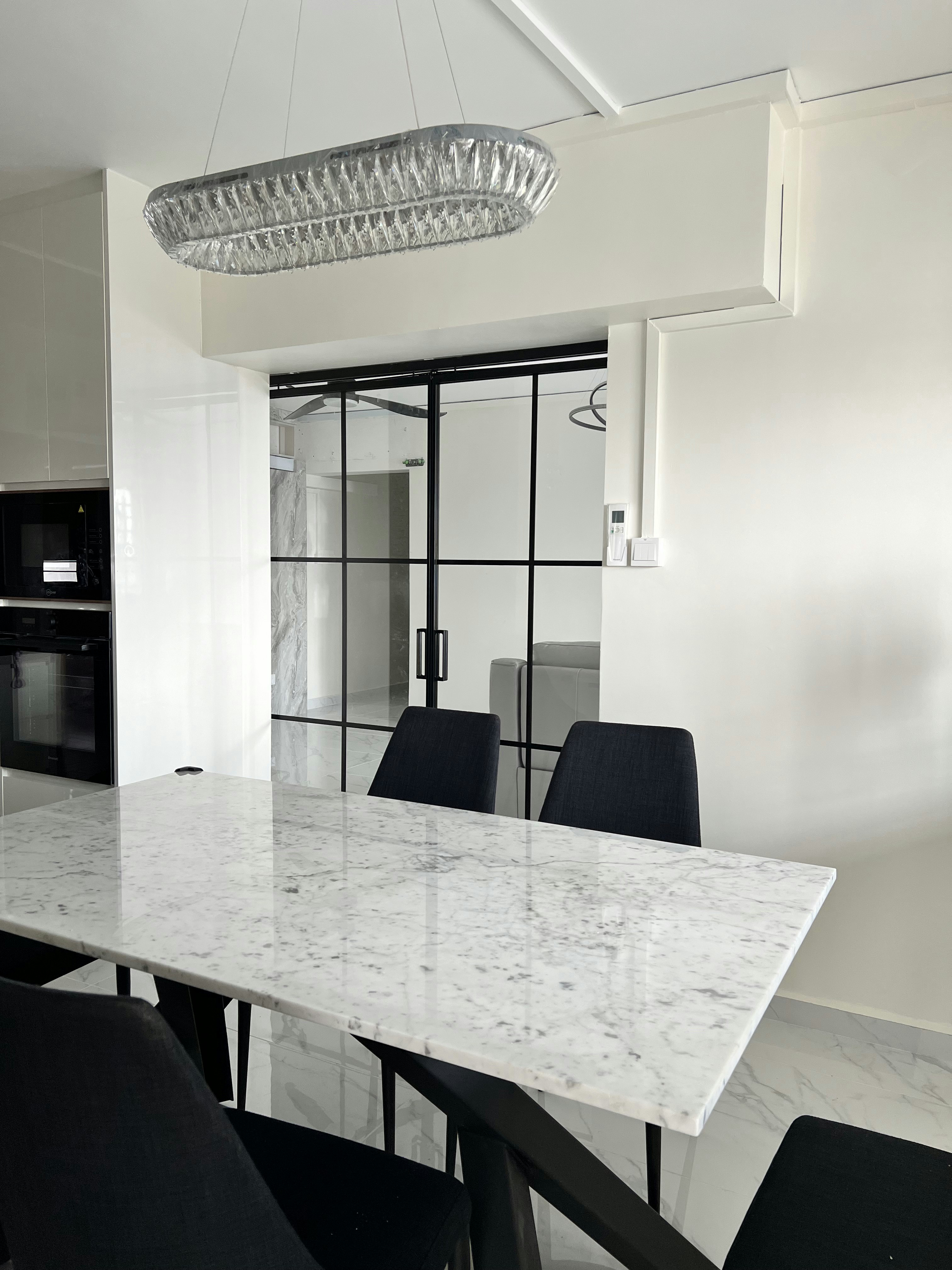 Our Dining Room & Dry Kitchen! Drop a comment with your styling tips - Modern kitchen with sleek black appliances, marble