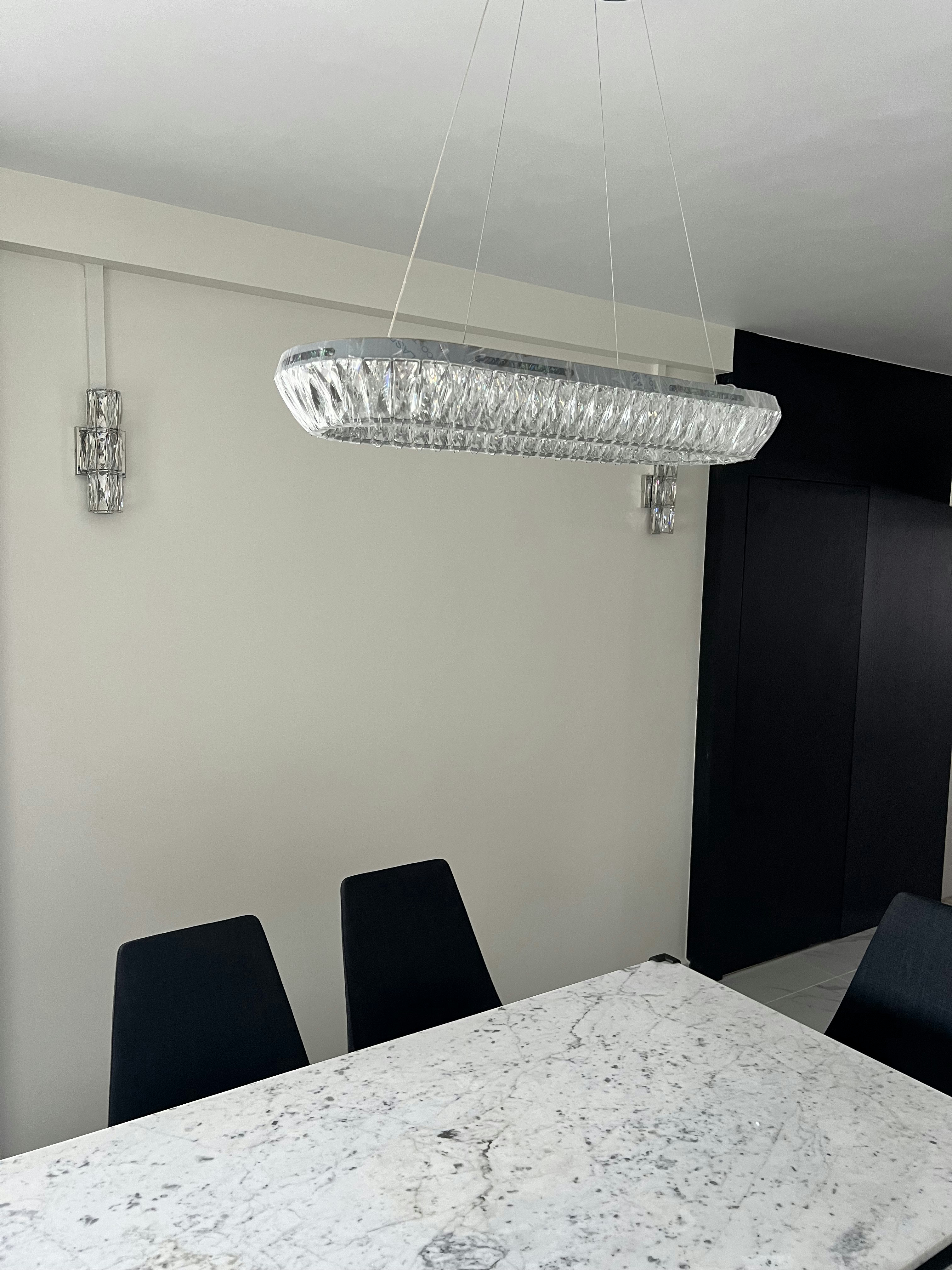 Our Dining Room & Dry Kitchen! Drop a comment with your styling tips - Modern dining room with sleek, crystal chandelier