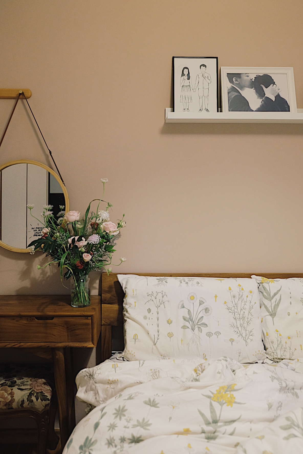 Cosy, tranquil and cottage home in a 2BR Dual-key Apt in the East - Floral arrangement on wooden nightstand, beige wall