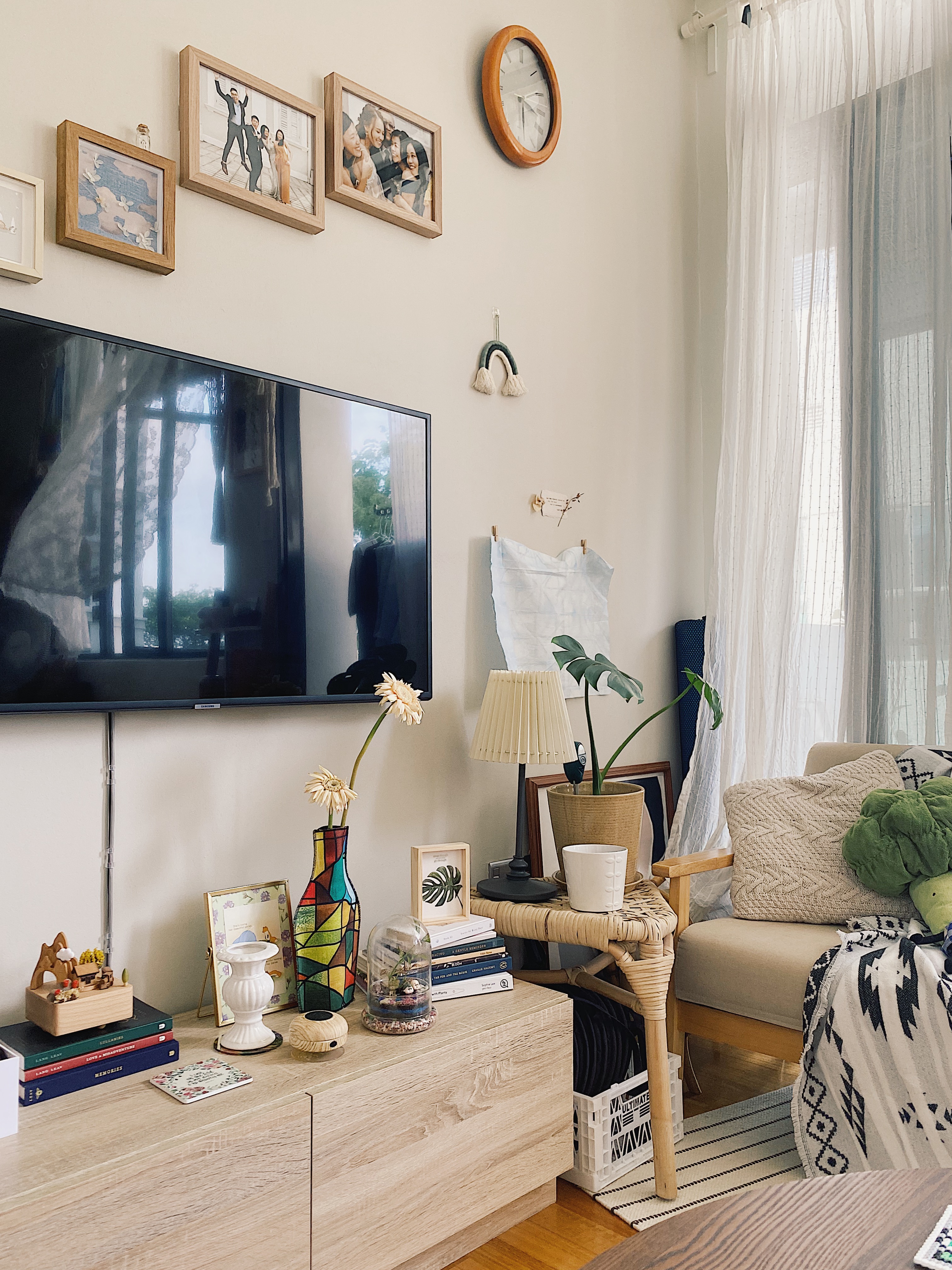 Cosy, tranquil and cottage home in a 2BR Dual-key Apt in the East - Wooden TV stand, framed pictures, clock, white curtains