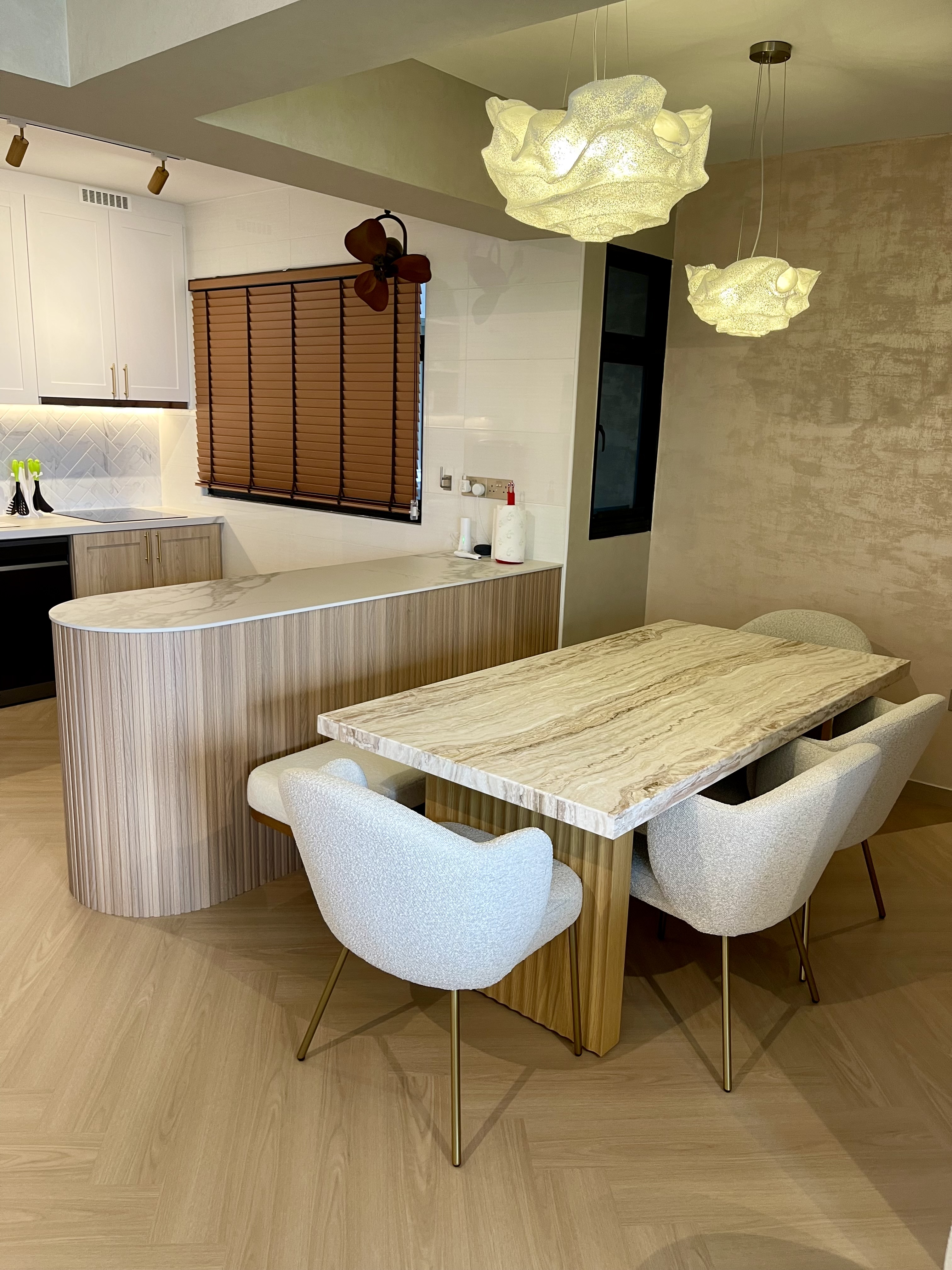 Our Dining Space: Where Fluted Meets Herringbone 🍽️✨ - Modern kitchen with marble dining table and chairs, contemporary
