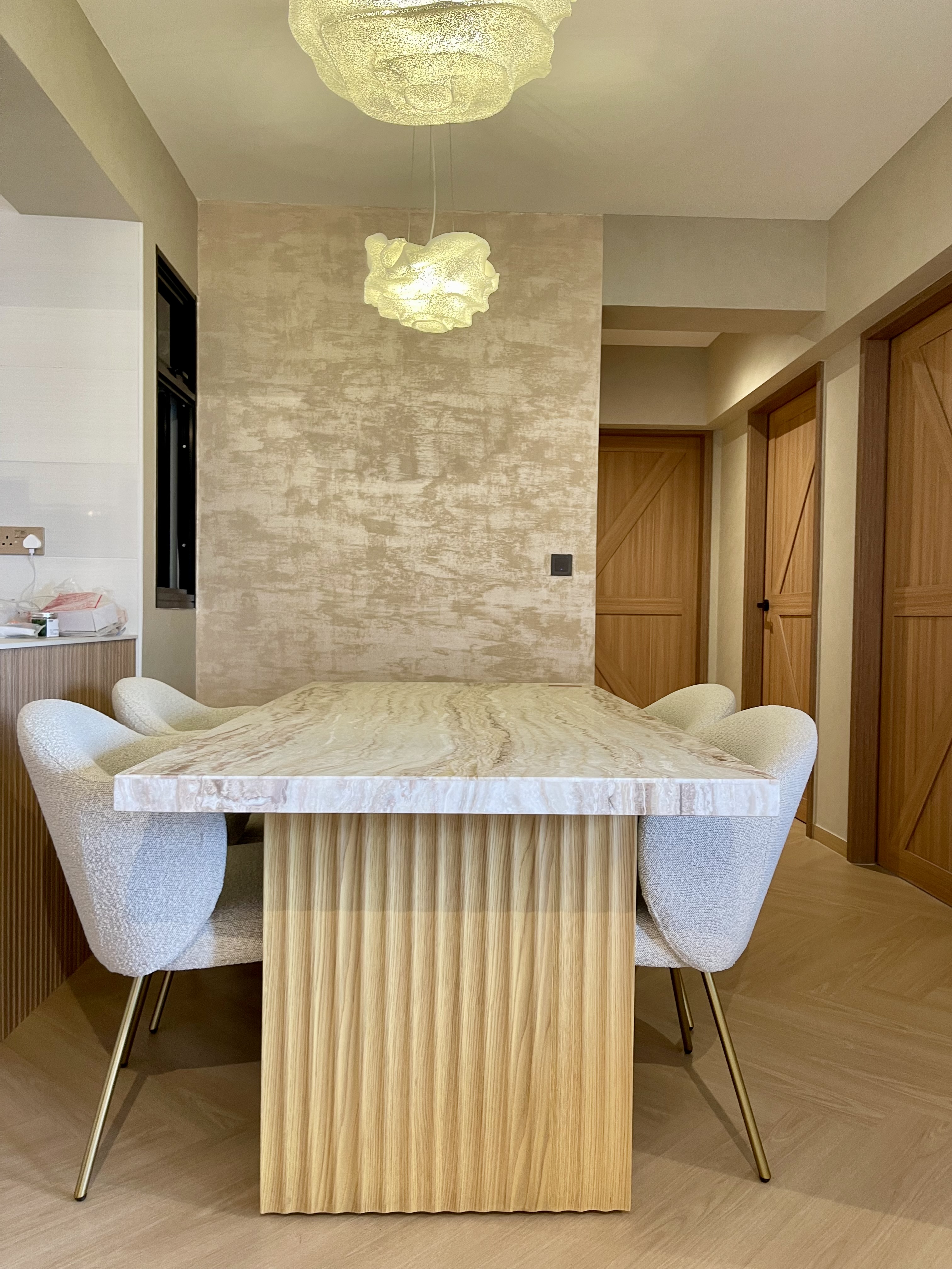 Our Dining Space: Where Fluted Meets Herringbone 🍽️✨ - Modern dining room with marble table and chairs, light beige textured
