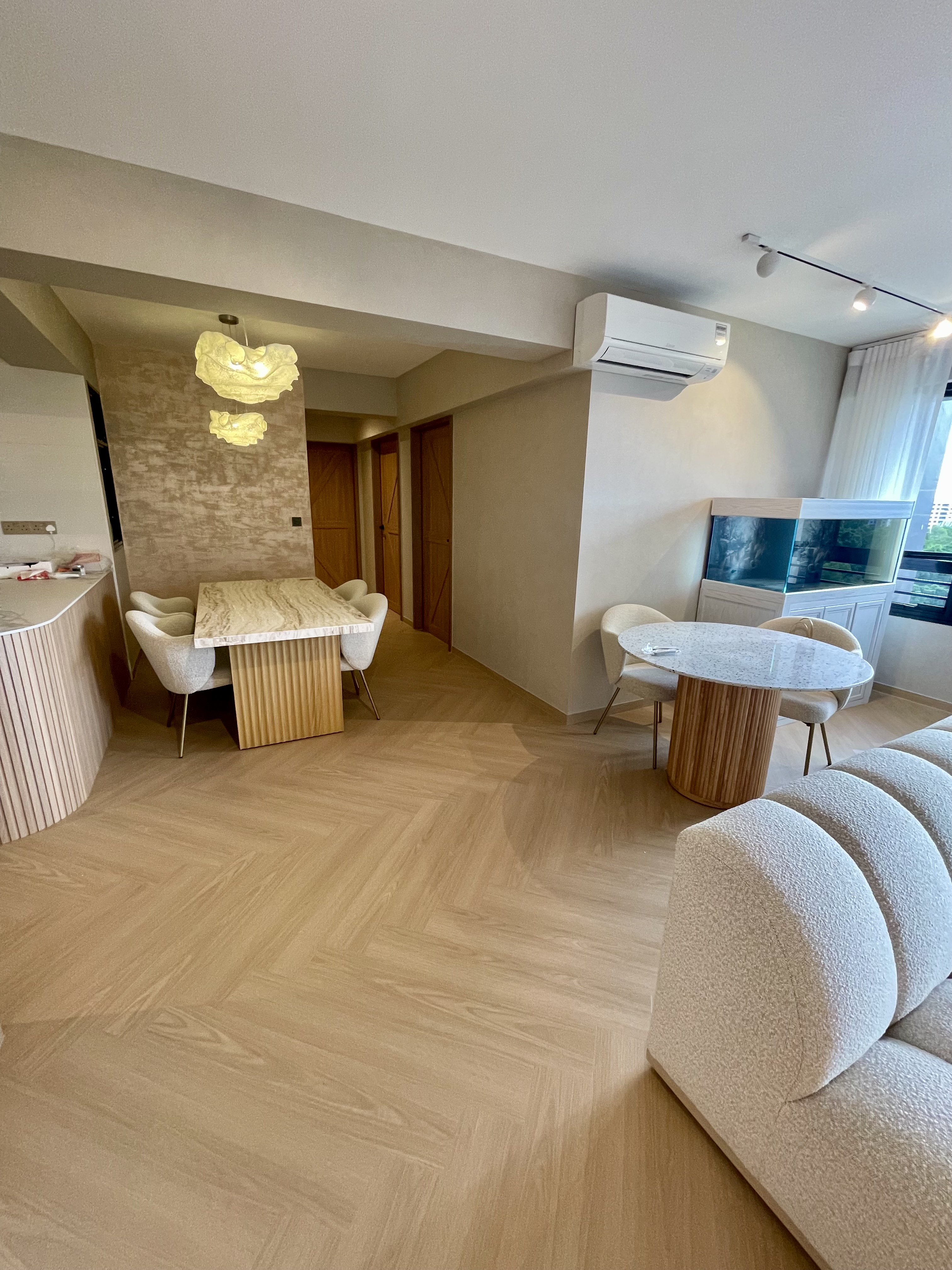 Our Dining Space: Where Fluted Meets Herringbone 🍽️✨ - Modern dining room with light beige walls, wooden flooring, and a