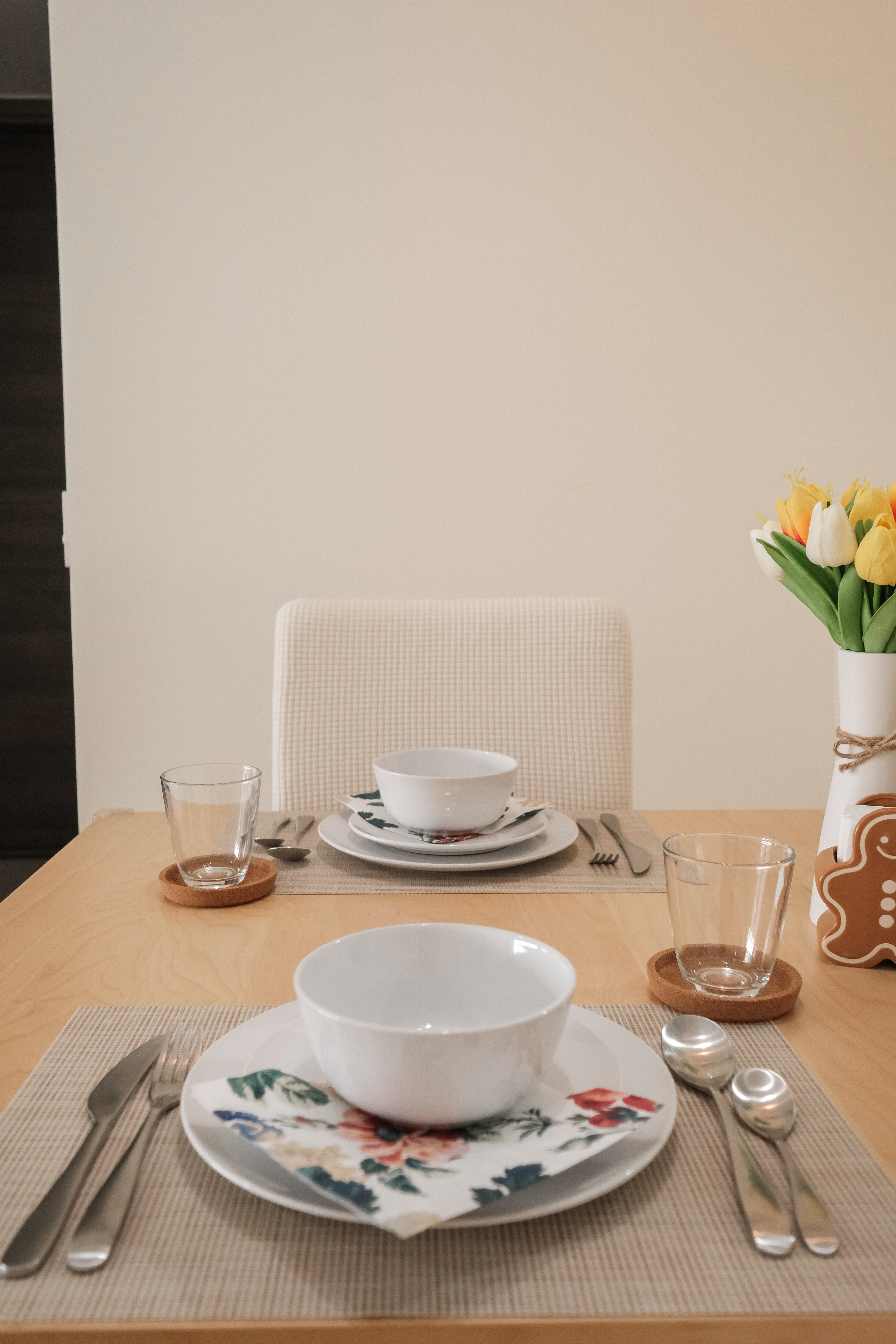 4 guests? 10 guests? Not a problem for our minimalist dining space! - White ceramic teacups and saucers, floral placemats