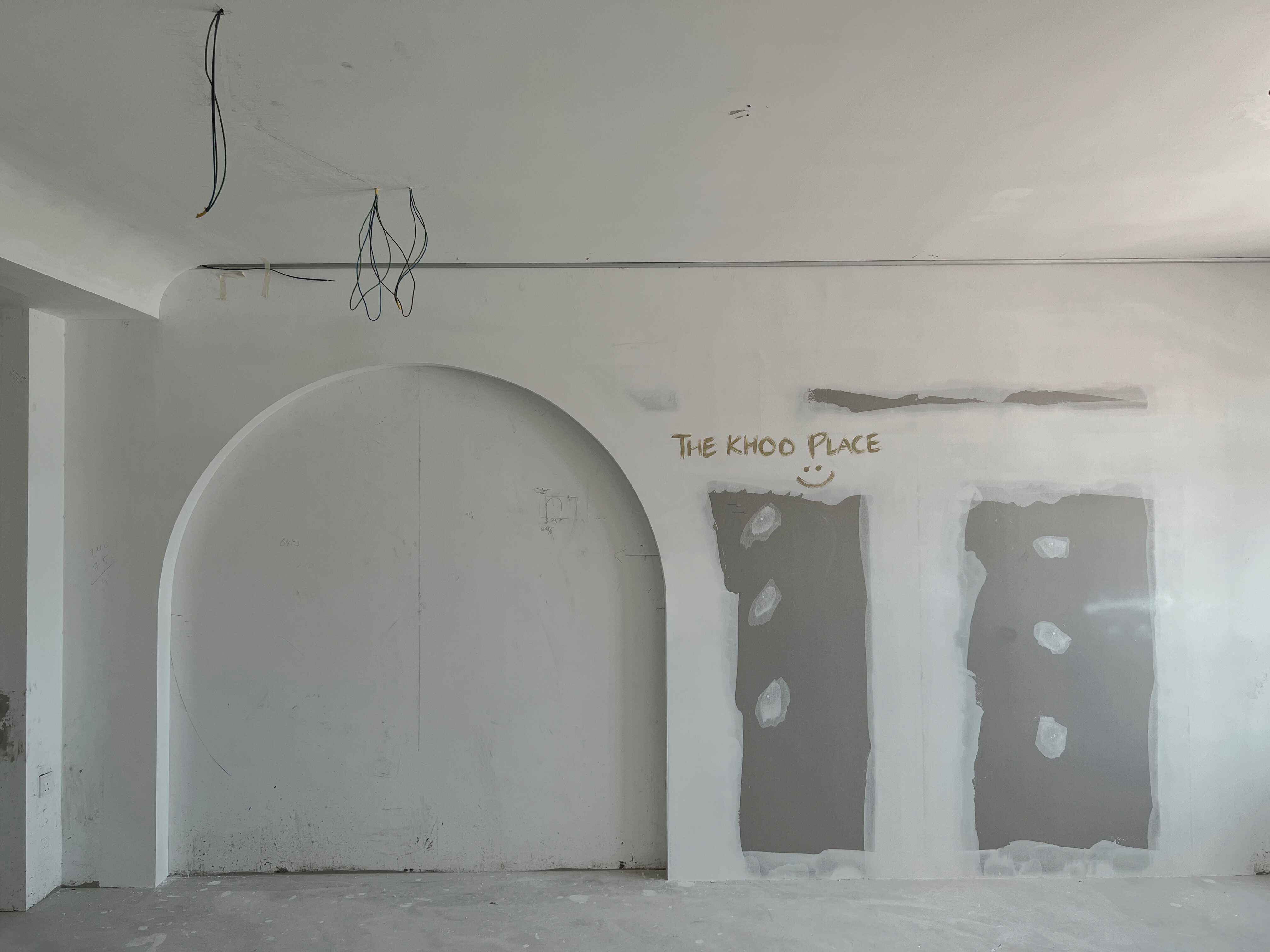 Our Dining Space: Creating Memories with Joyful Conversations - White unfinished room, bare concrete floor, exposed pipes