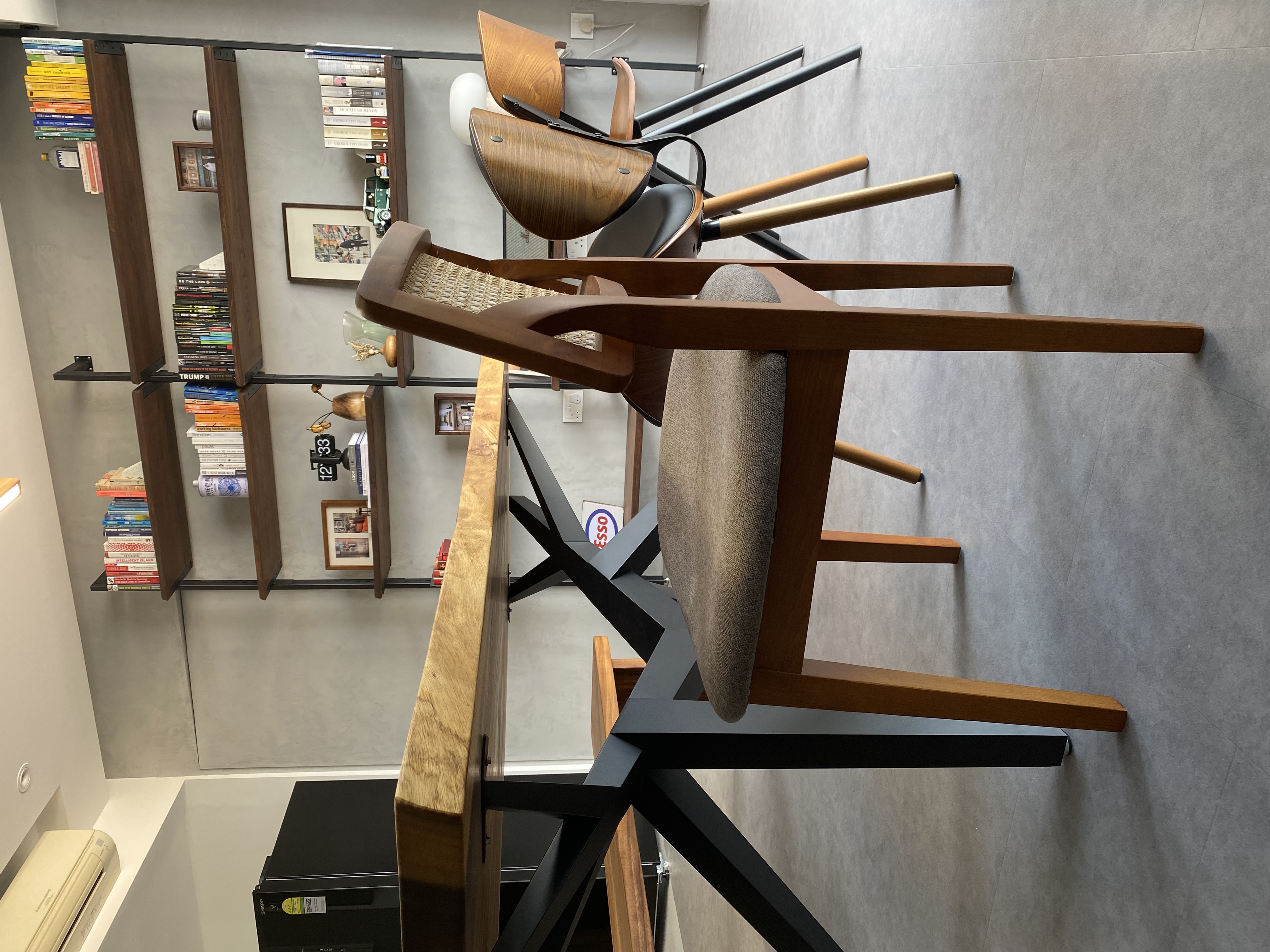 Dining, living, working and everything in between - Wooden bookshelf, modern design, book collection, stacked books