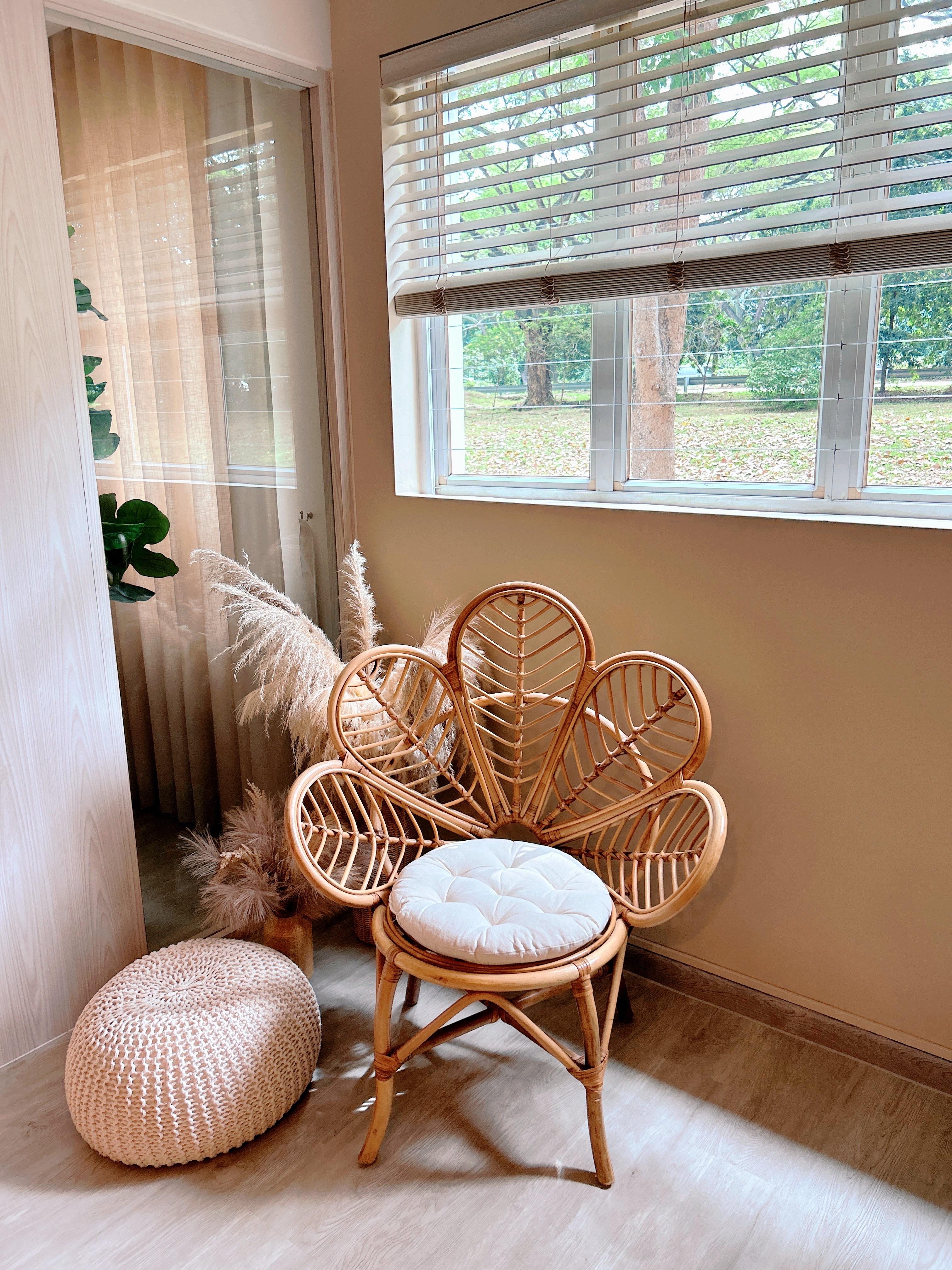 Creating Comfort: Our Personalized Home Decor - Woven chair, natural wood, cozy corner, indoor setting, soft lighting, pastel