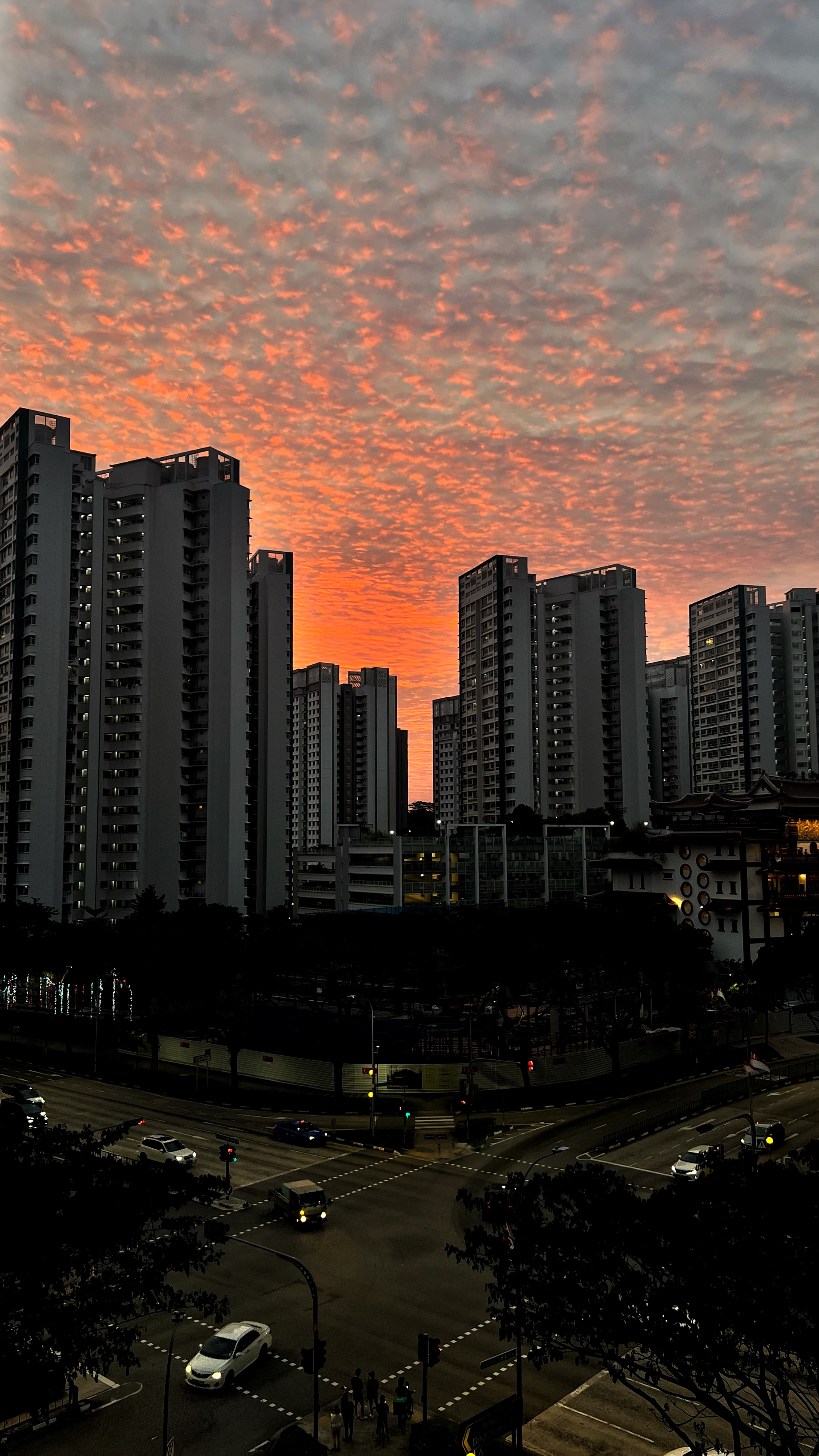 The Social Hub: Creating a space about connection and conversation - Sunset over city skyline, tall residential buildings