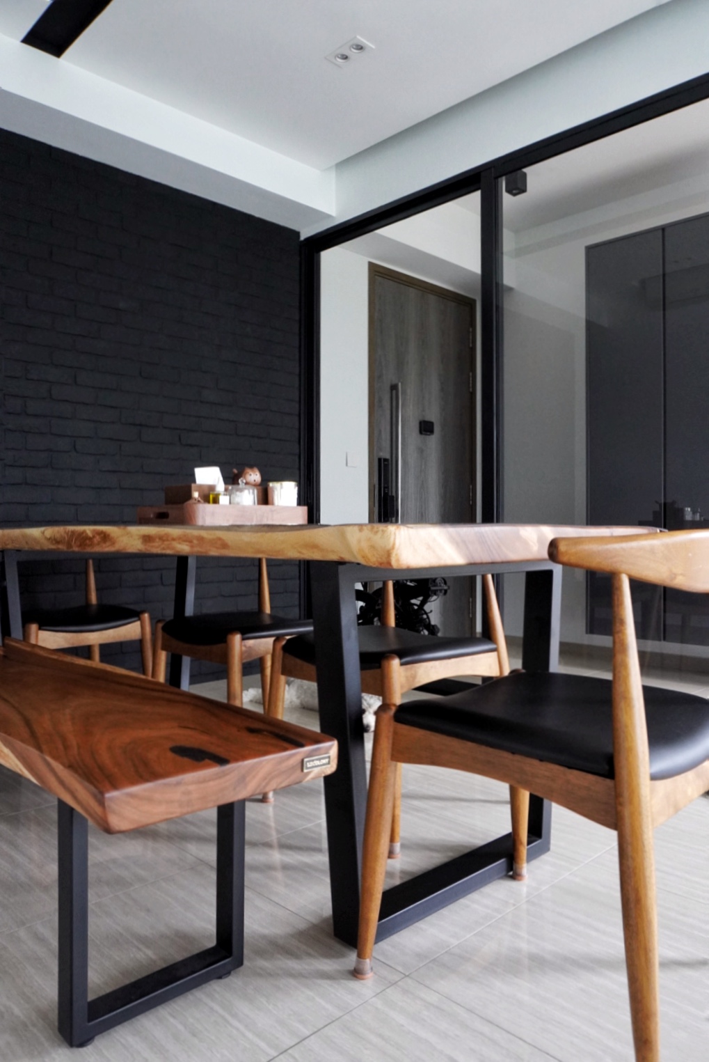 The Social Hub: Creating a space about connection and conversation - Wooden dining table with black metal frame, minimalist