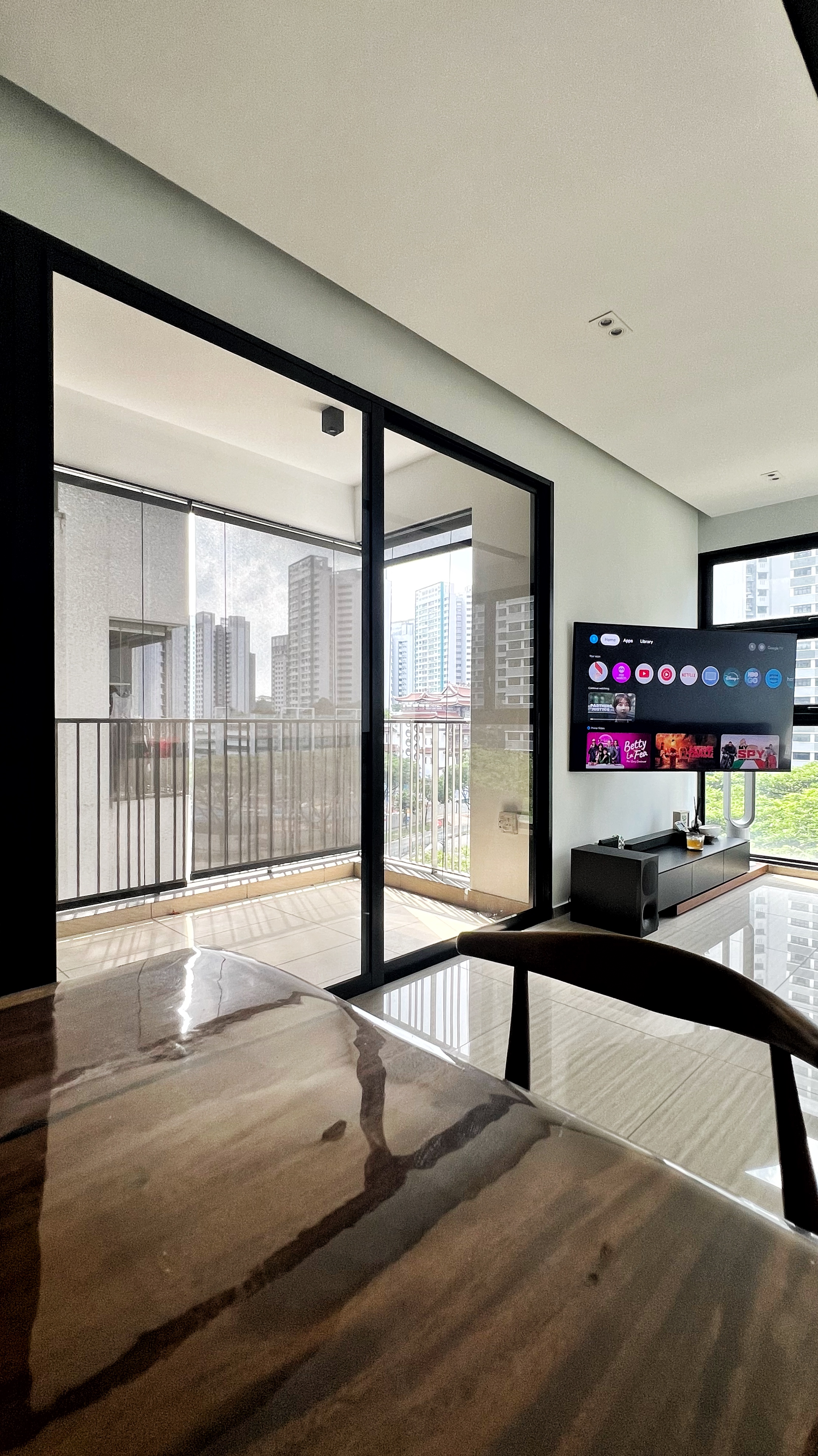 The Social Hub: Creating a space about connection and conversation - Modern living room, panoramic view, glass doors