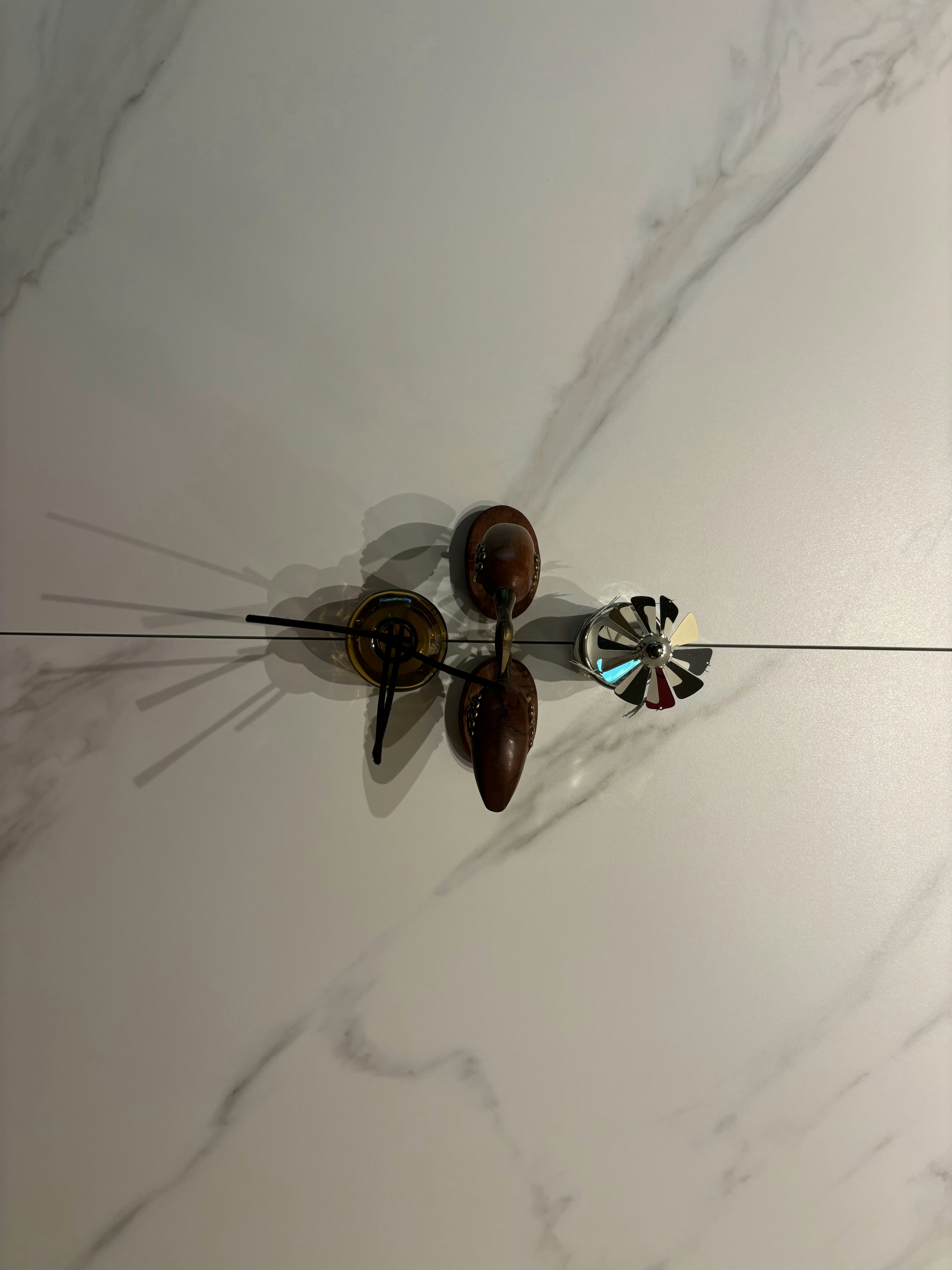 Our Dining Space: Where everything happens (even a fish tank!) - Marble surface, shadow, wooden object, decorative items