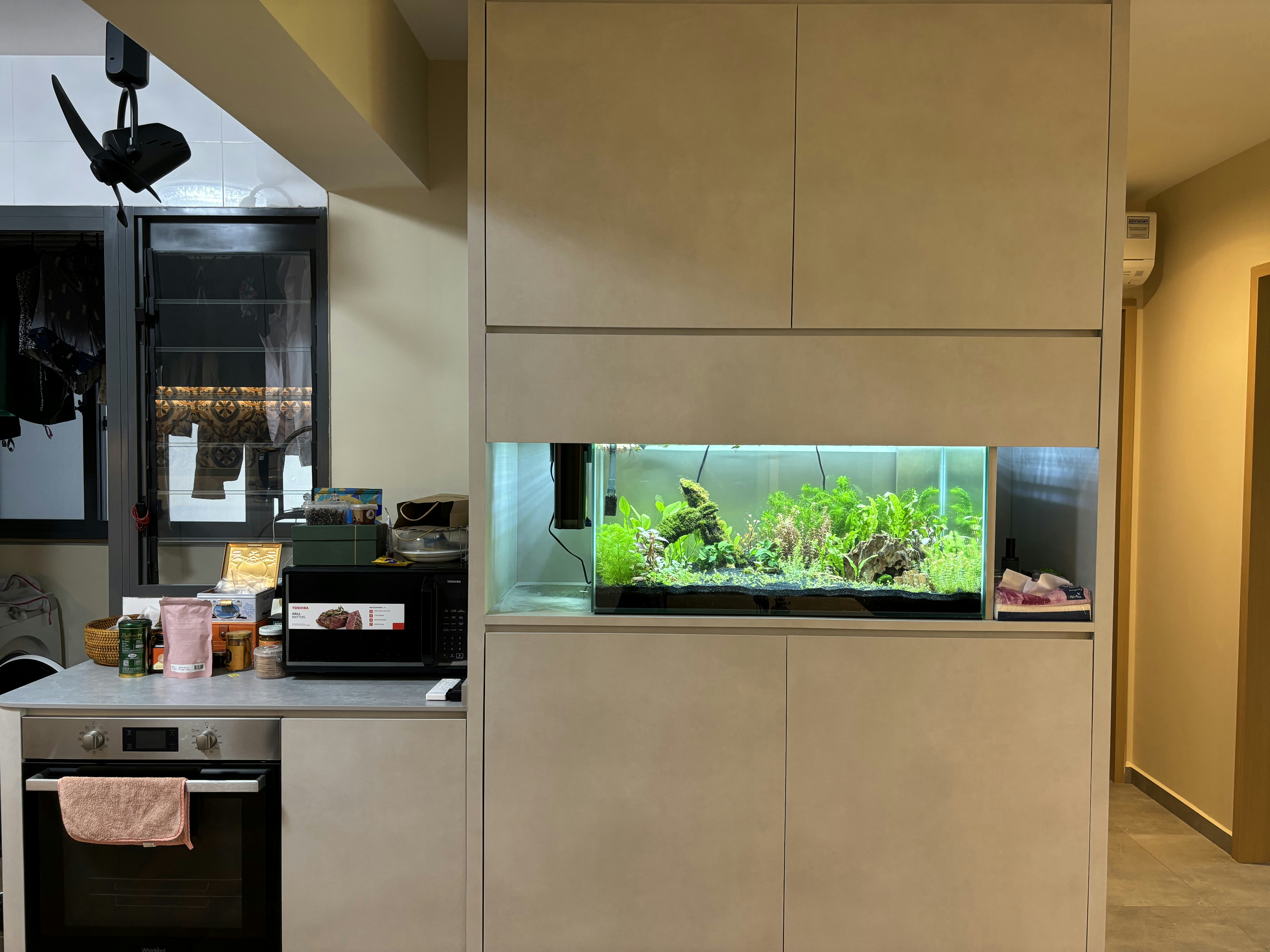 Our Dining Space: Where everything happens (even a fish tank!) - Modern kitchen with built-in appliances, stainless steel