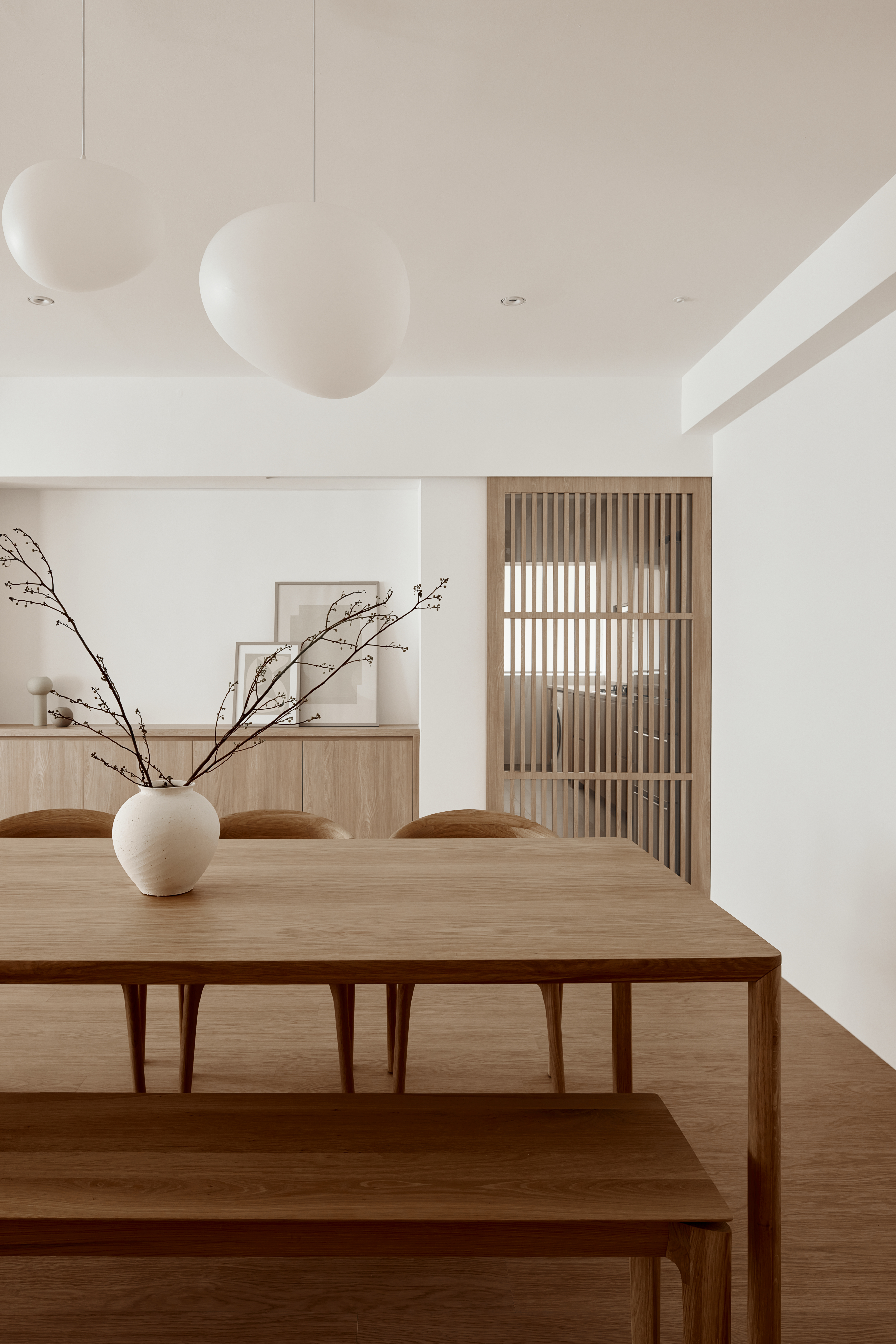 House Tour: A Japandi Minimalist 5-Room BTO - Modern minimalist dining room, sleek wooden table, elegant pendant lights