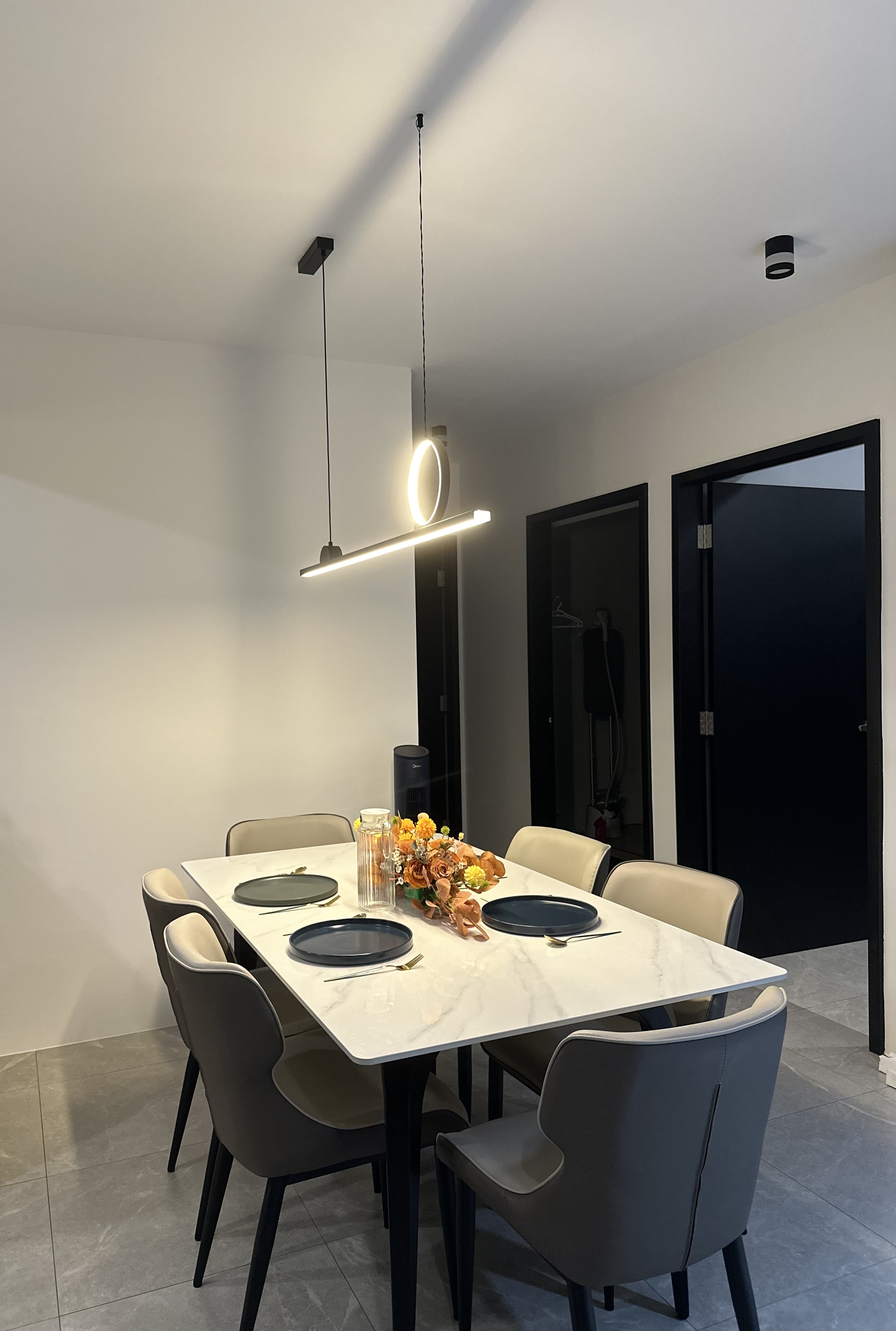 Amber-Hued Dining Space 🍂🍁🧡☕ - Modern dining room, minimalist design, sleek furniture, white marble table, black chairs