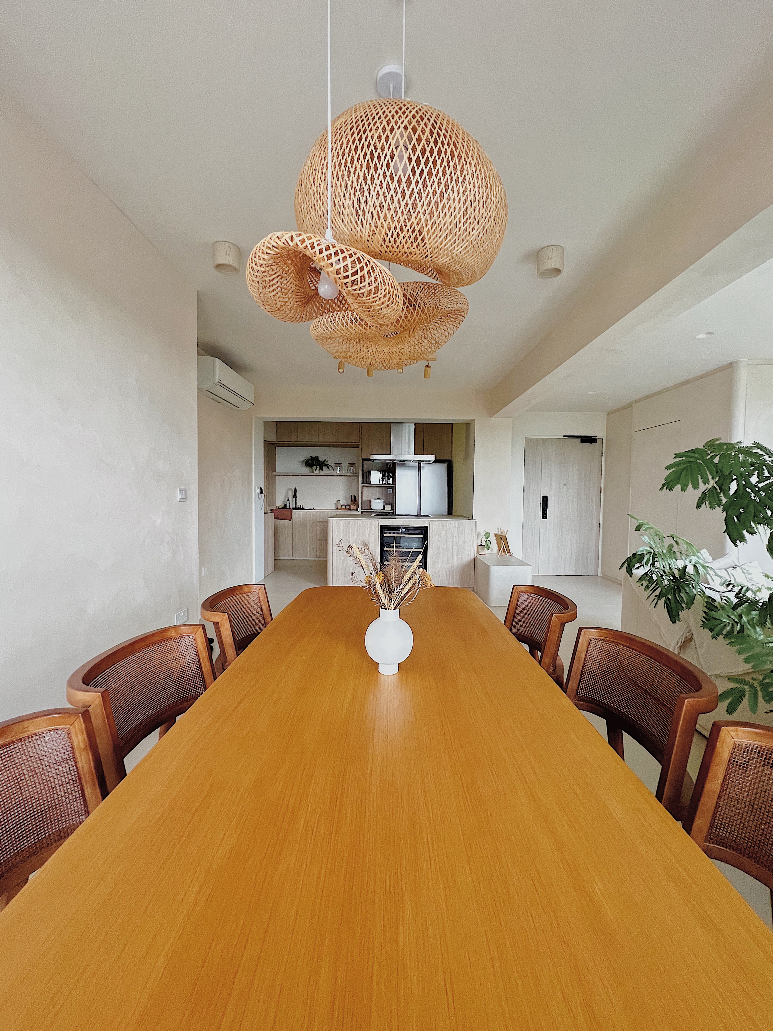 Come experience Japandi Minimalism: Our Dining Room  - Modern dining room with wooden table and chairs, large woven pendant