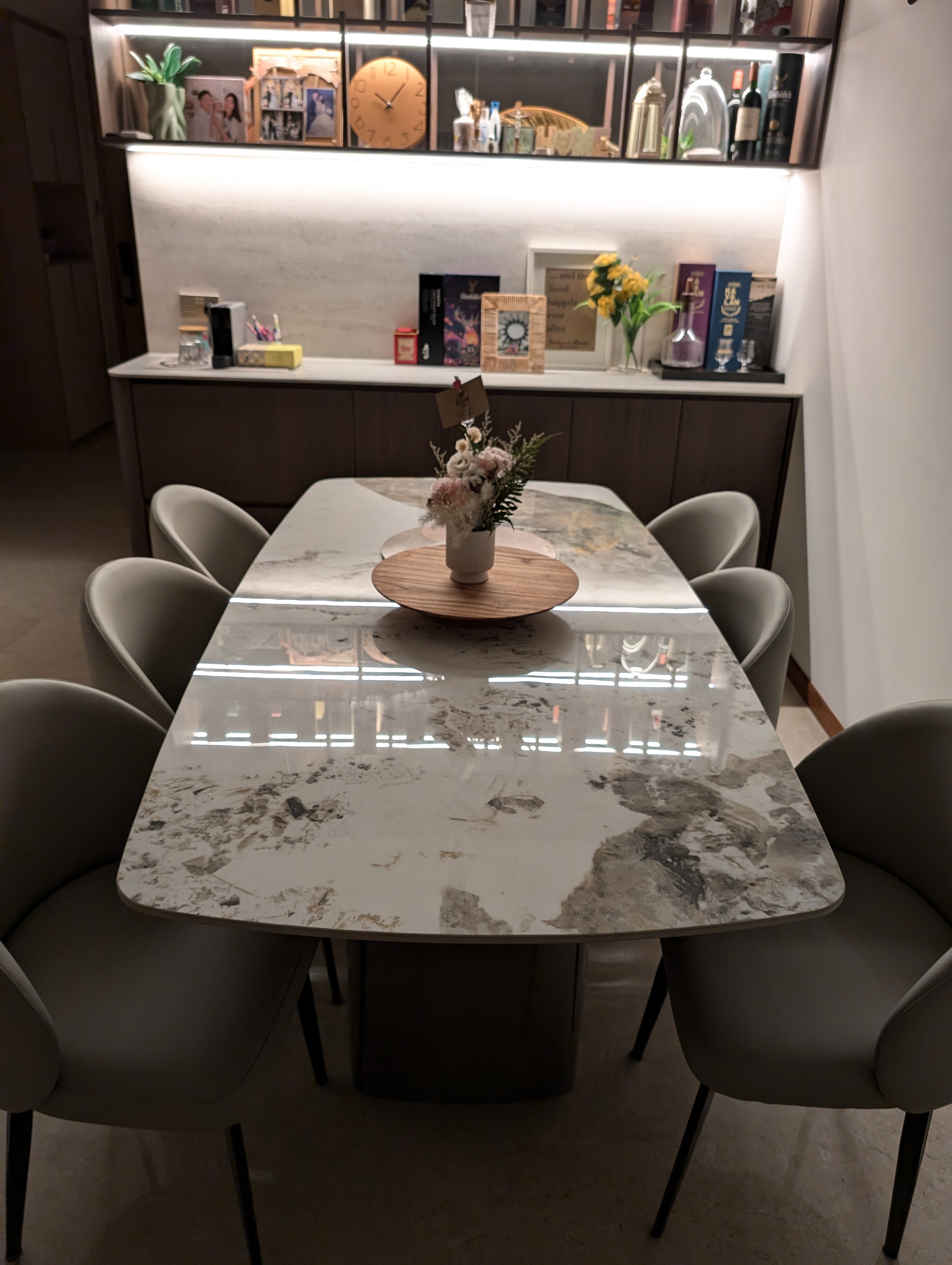 Let the party begin! - At our dining room - Modern dining room, marble table, elegant chairs, sophisticated decor, warm