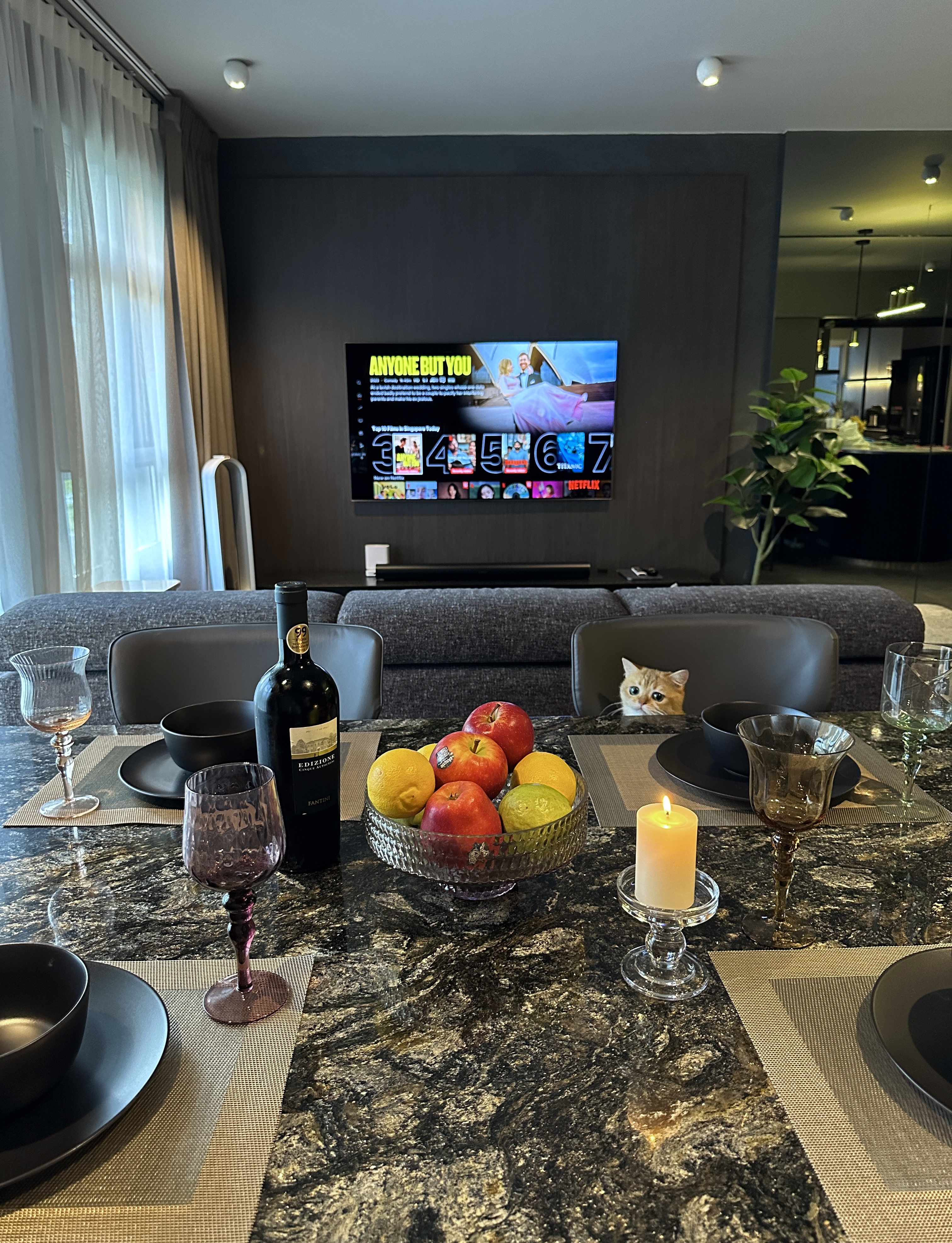 Elegant and Functional: A Glimpse of Our Dark Minimalist Dining Space - Modern dining room, elegant table setting, wine